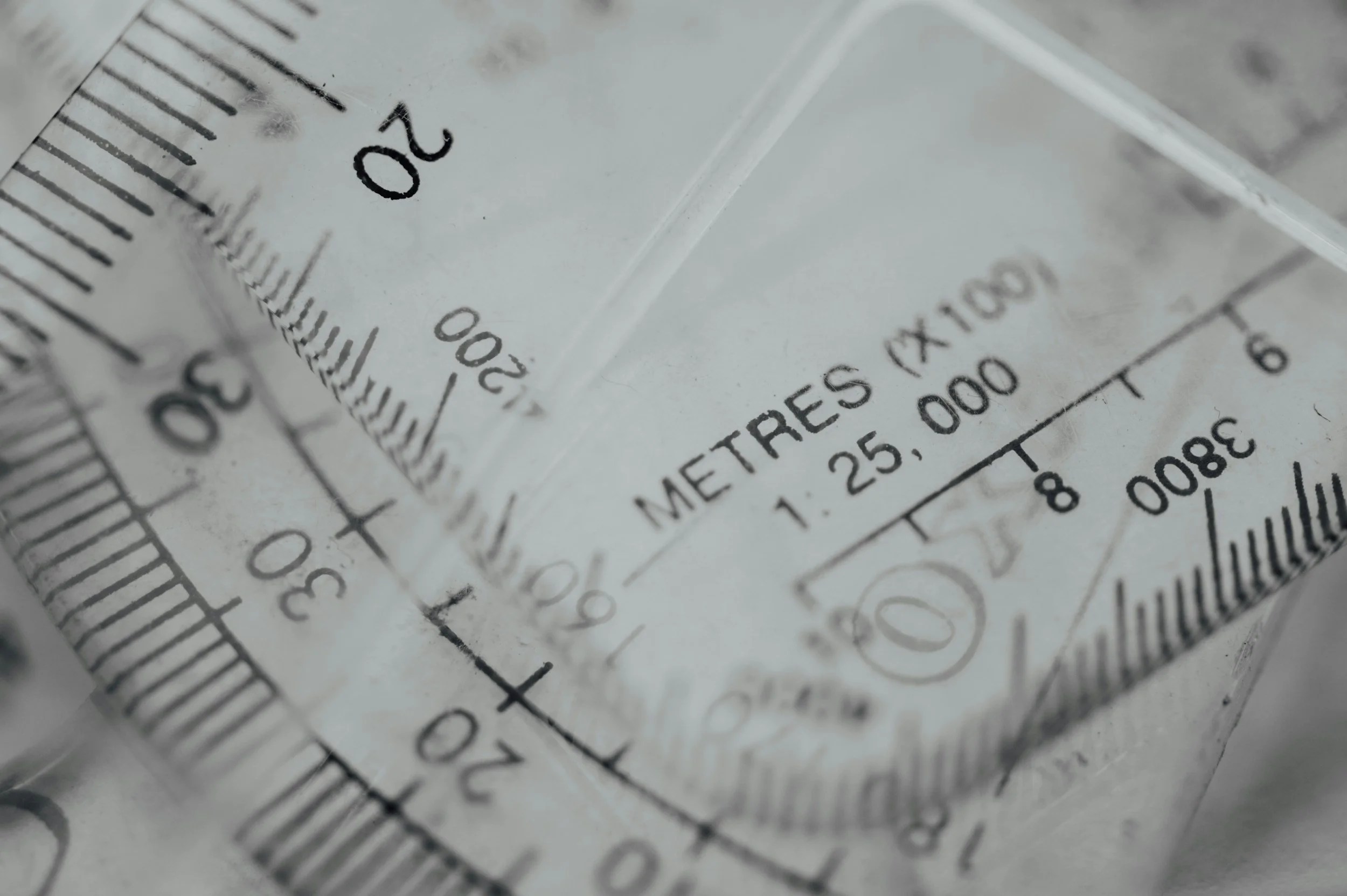 Close-up of a transparent measuring tape showing the measurement 1.25 meters.