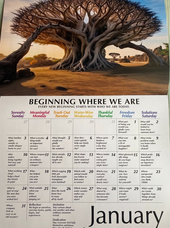 January page of the 2027 Living in Rhythm Family Calendar, featuring a daily conversation question and a large tree in a warm sunset landscape.