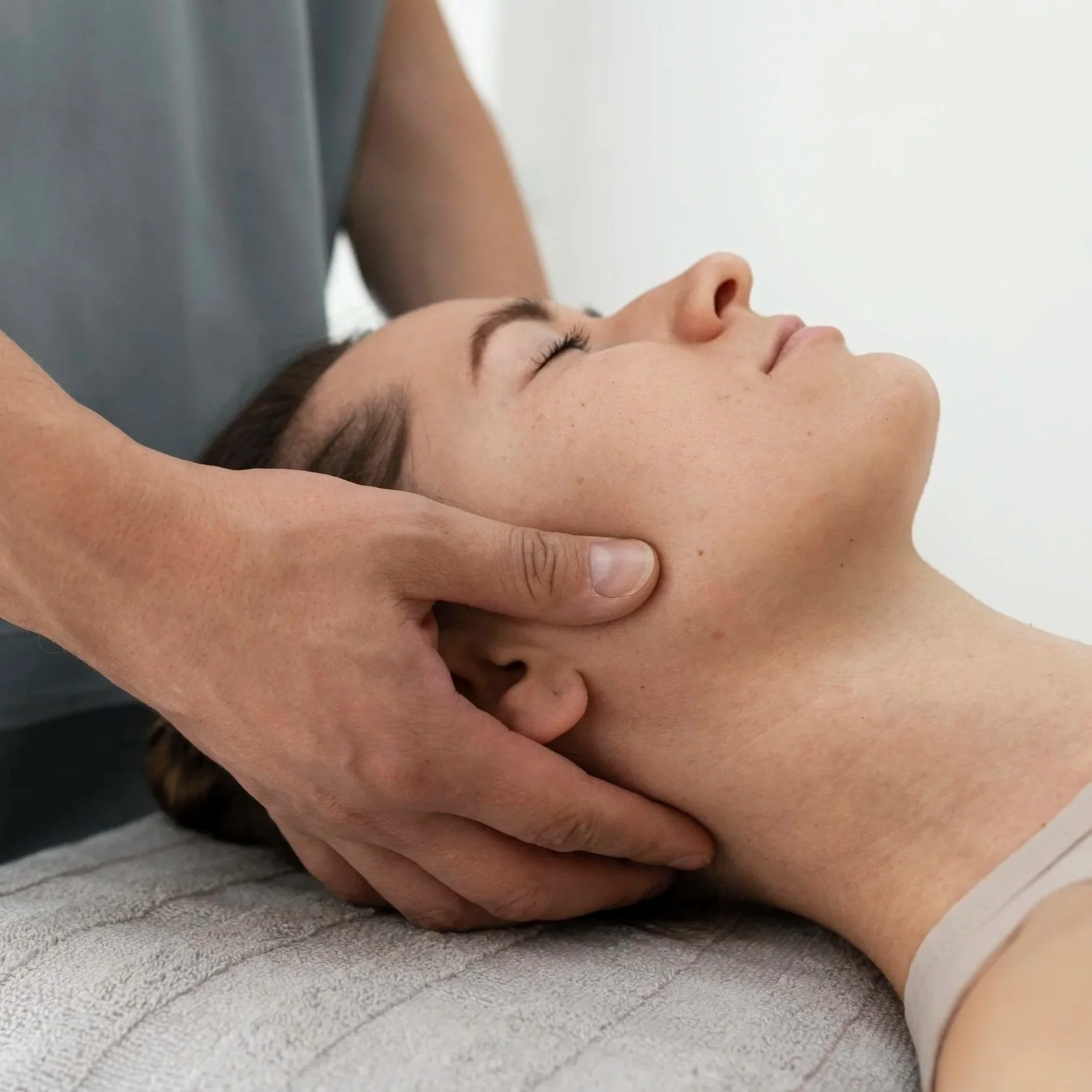 a man receiving TMJ  jaw pain massage