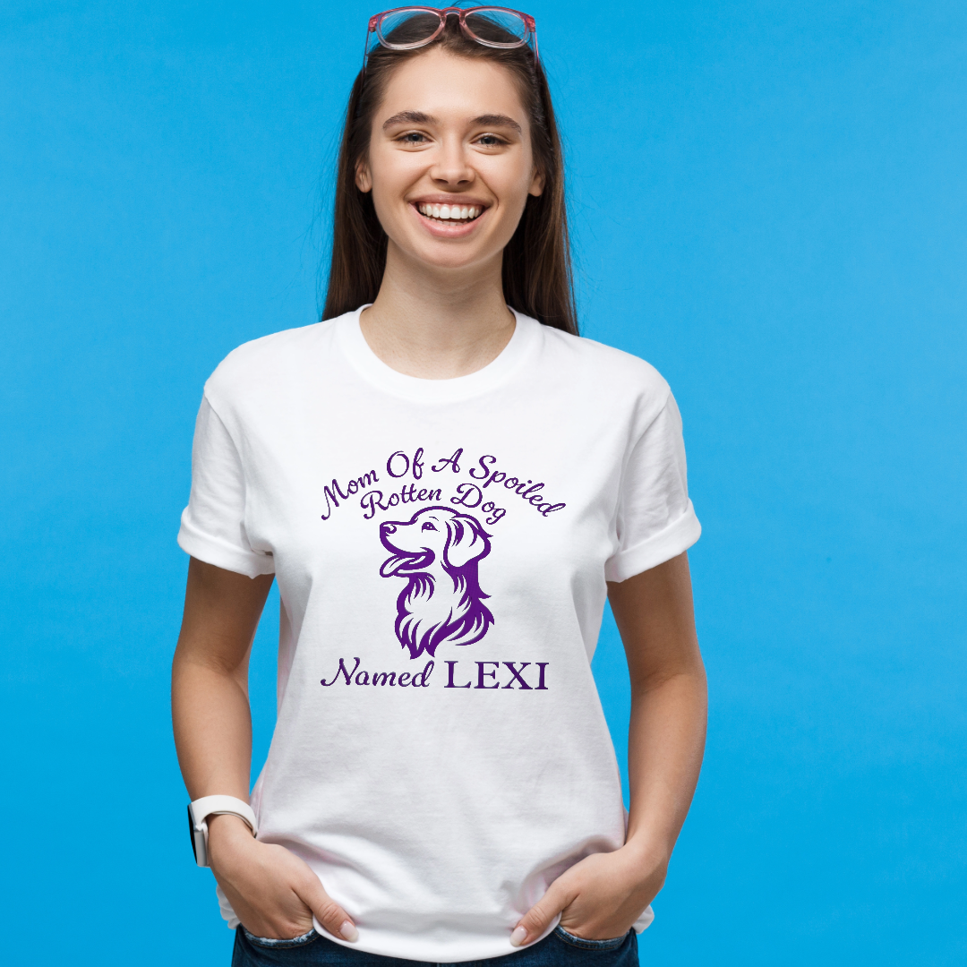 Young woman smiling, wearing a white T-shirt with purple text and dog graphic, standing against a blue background.