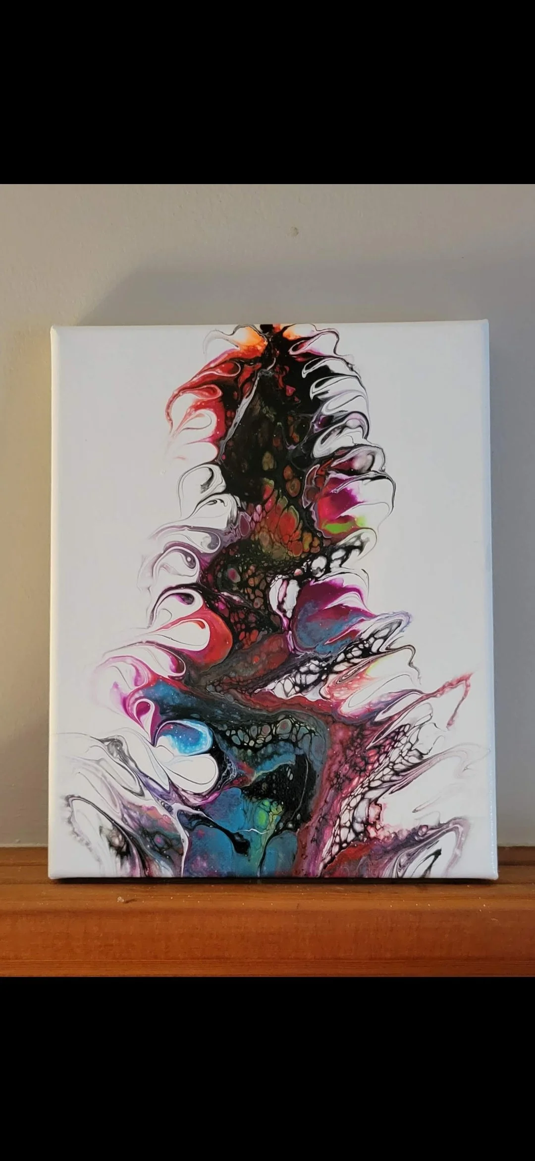 Abstract colorful acrylic pour painting on canvas