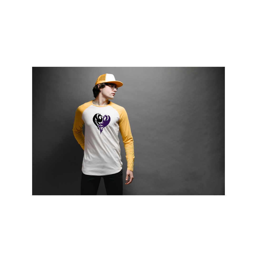 A young man wearing a yellow and white baseball cap, glasses, and a white and yellow baseball-style shirt with a black and purple heart logo, standing against a grey background.