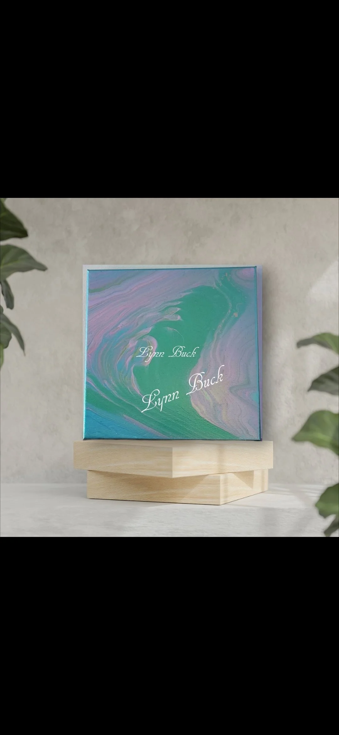 Album cover with a swirling, colorful marbled design in shades of green, purple, and blue, with the name 'Lynn Buck' written twice in white cursive.