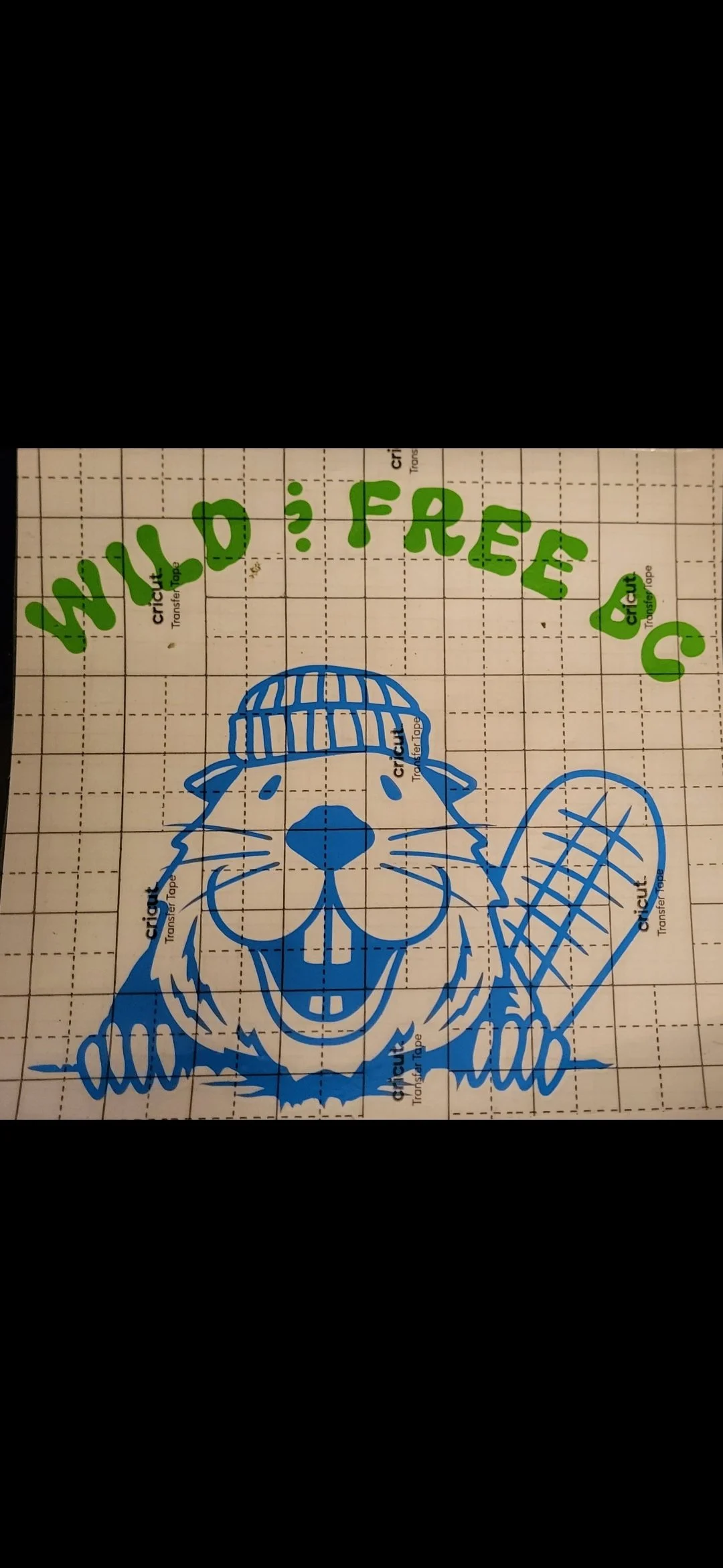 Blue and white illustration of a dog wearing a beanie and holding a bat, with green text above reading 'WILD ? FREE'.
