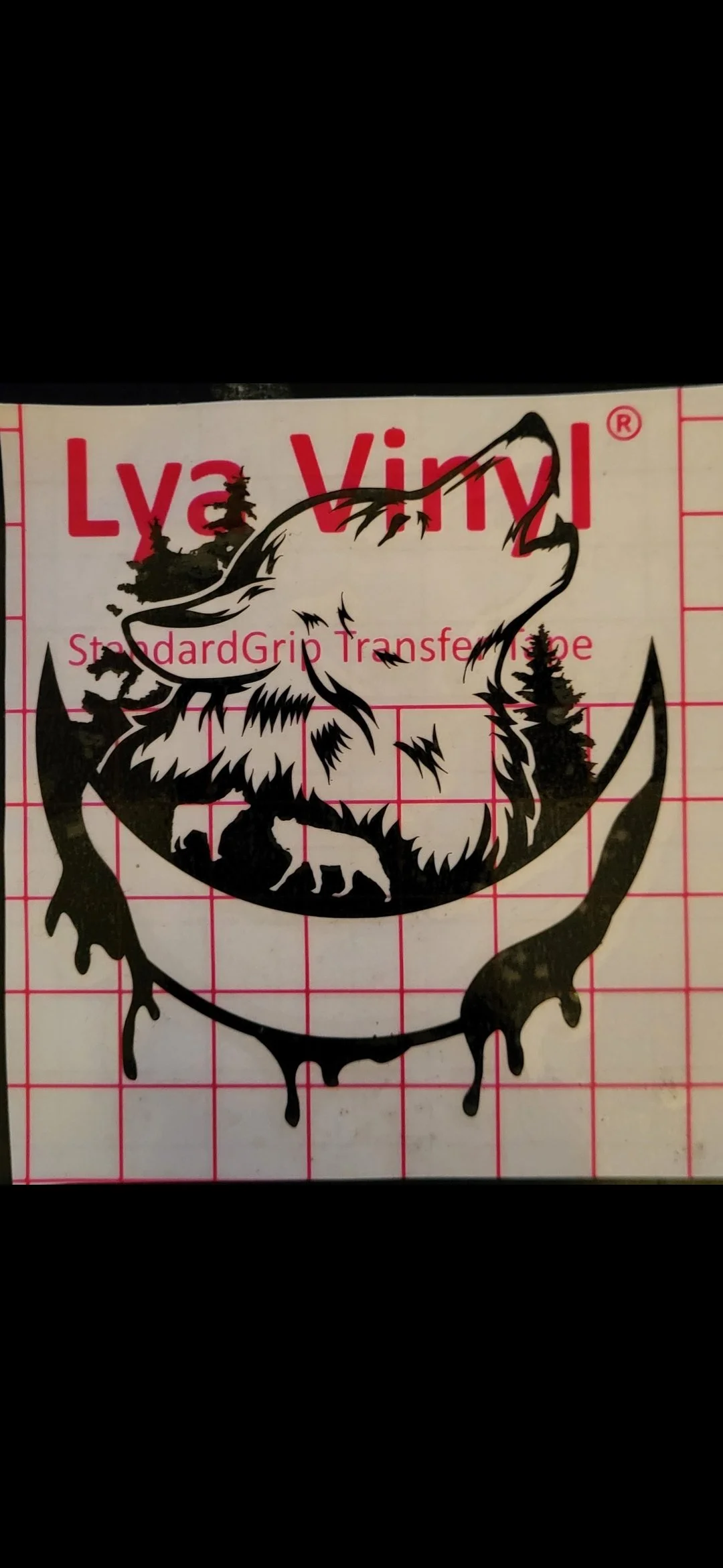 Black and white graphic of a roaring bear with trees on its head inside a circular design, placed on a grid background, with red text reading "Lya Vinyl" and "Standard Grip Transfer Tape."