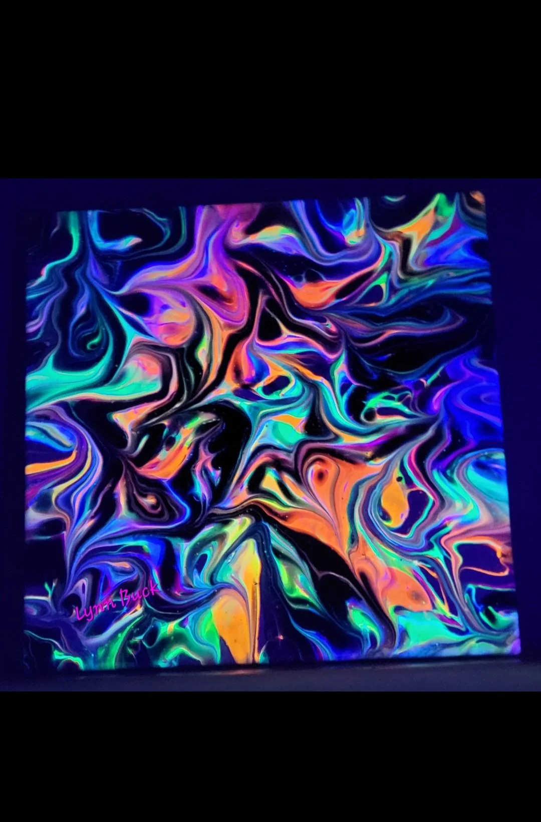 Abstract colorful swirling paint on canvas with the artist's signature 'Lynn Buck' in pink in the bottom left corner.