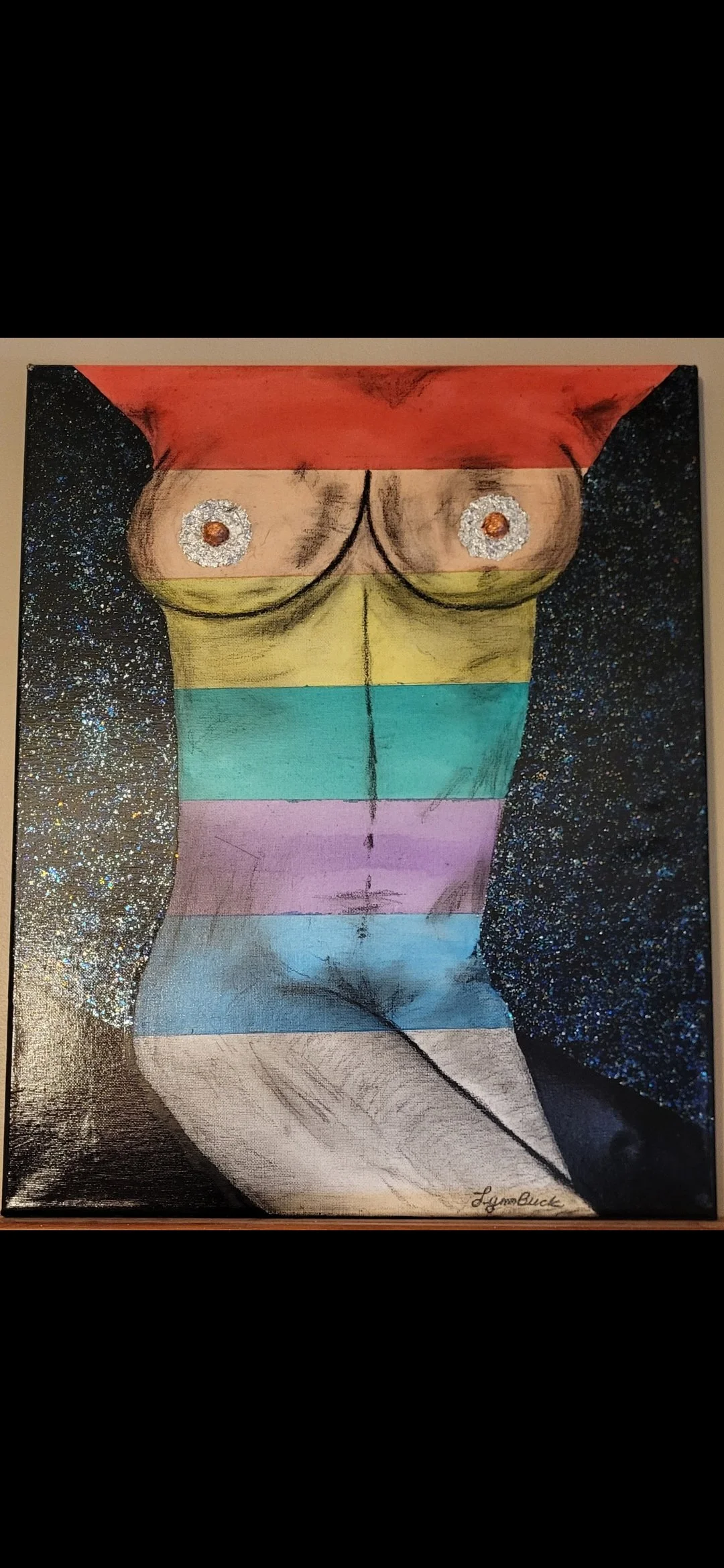 A painting of a human torso with rainbow stripes, featuring glittery flower designs over the nipples, and a starry background.