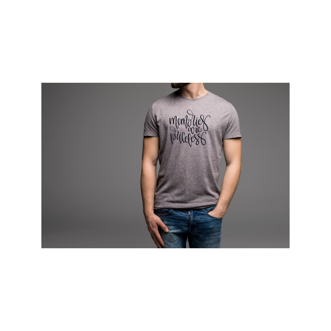 Person wearing a gray T-shirt with the phrase "Memories are Priceless" written in black cursive font, standing against a gray background.