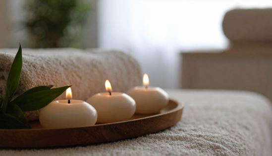 Candles and towels in a massage treatment room.