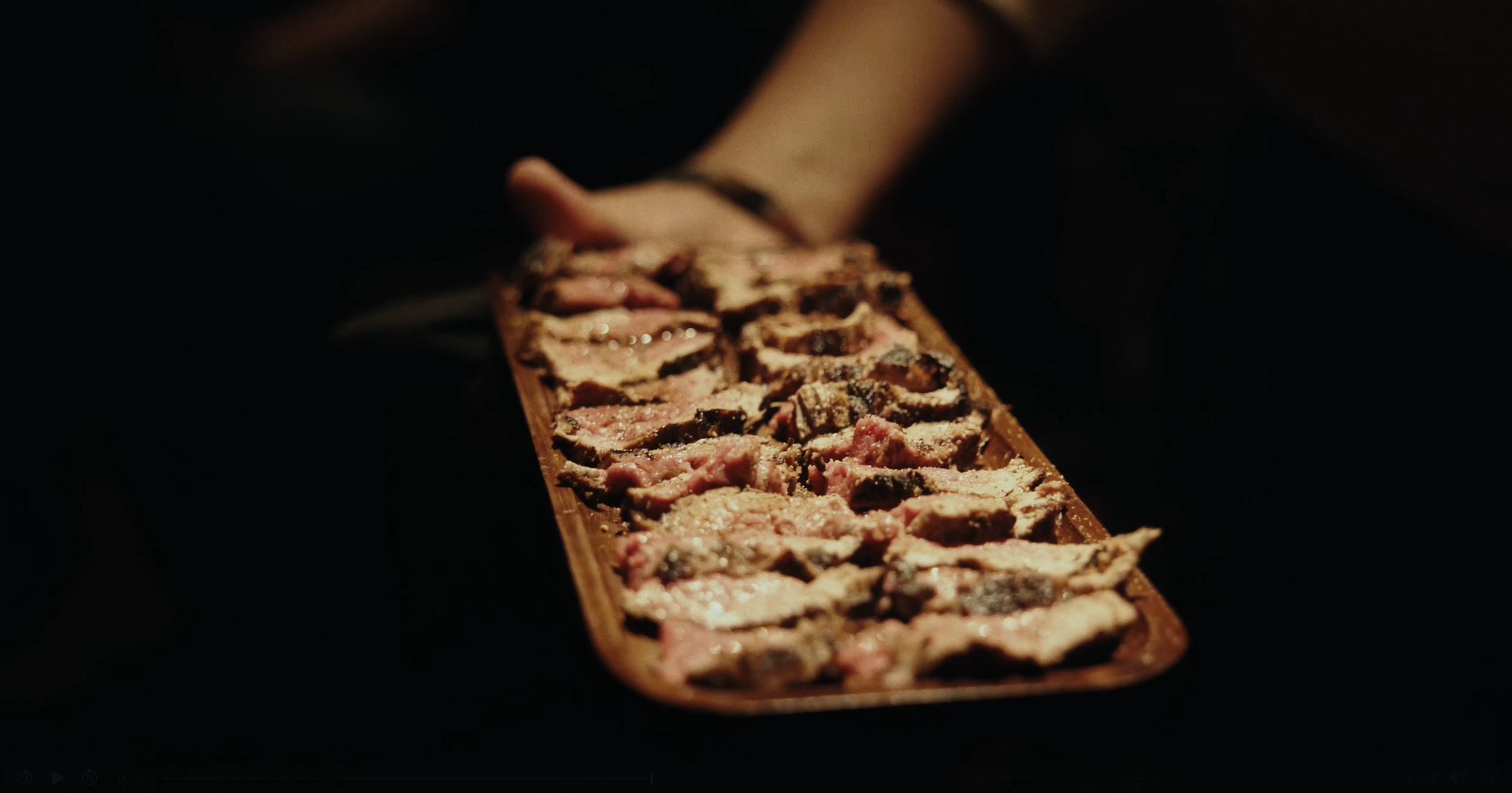 raw fish fillets on a wooden cutting board.