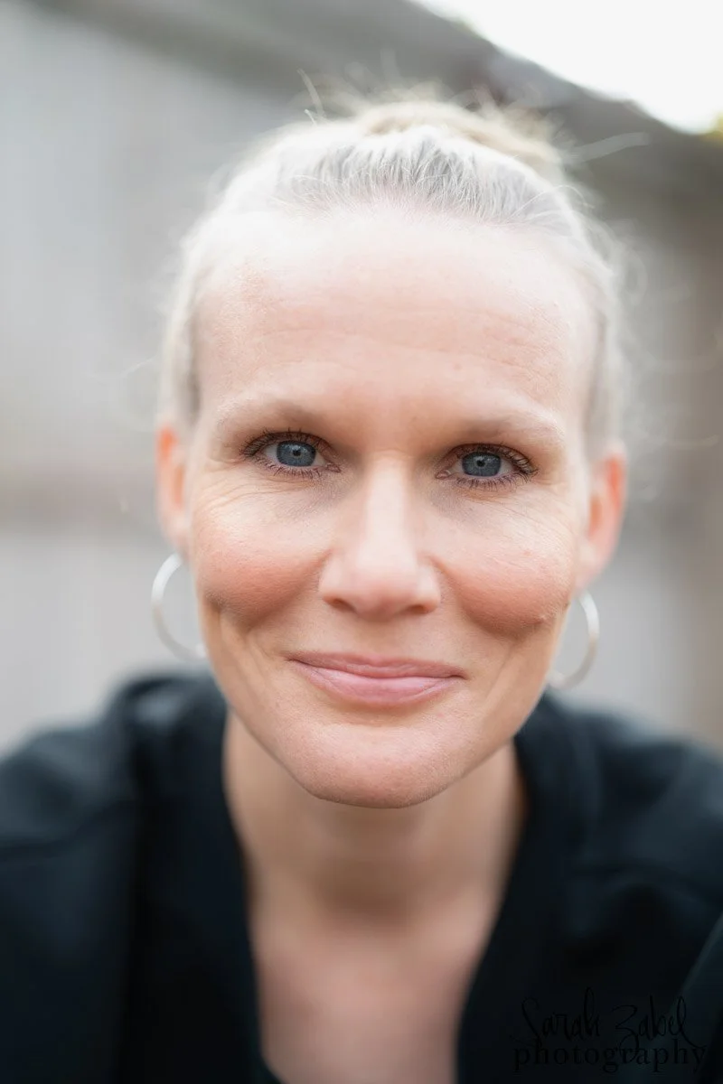 photo of Sarah smiling and staring into your eyes, delivering the hypnotic message, "hire me"