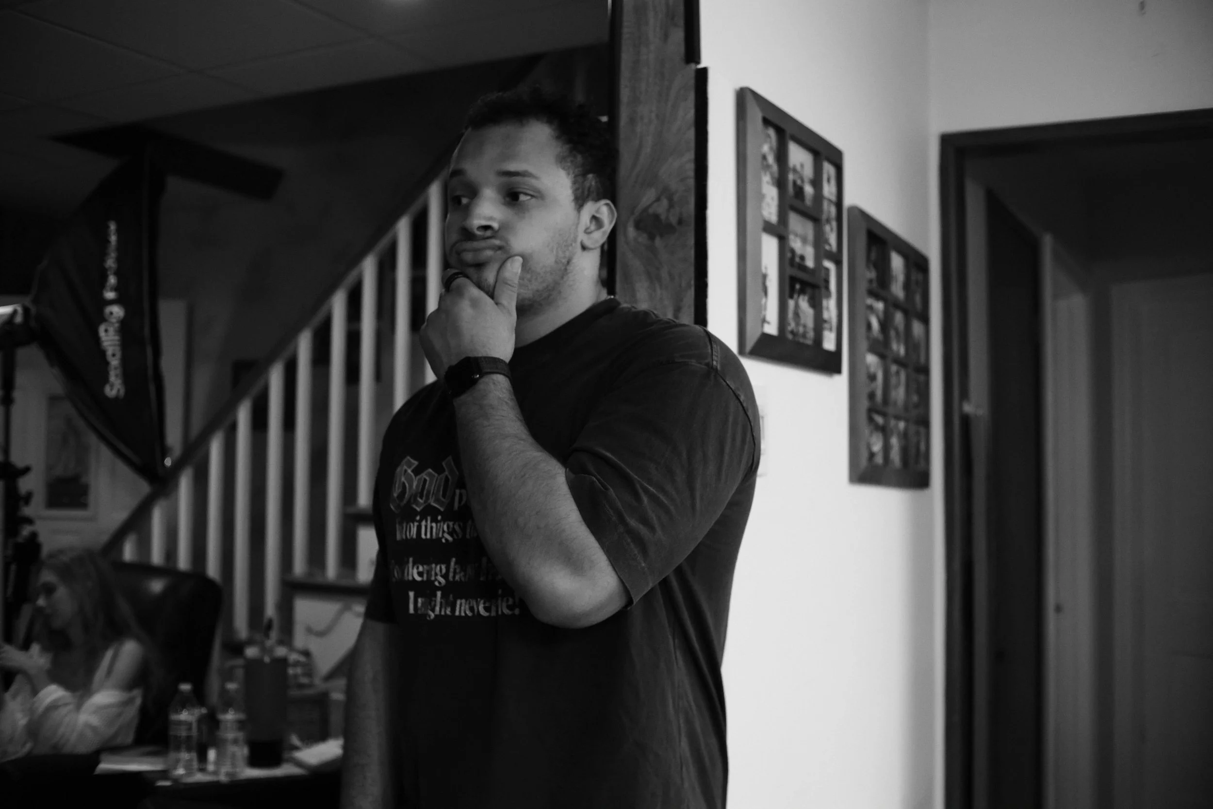 John looking and pondering on set