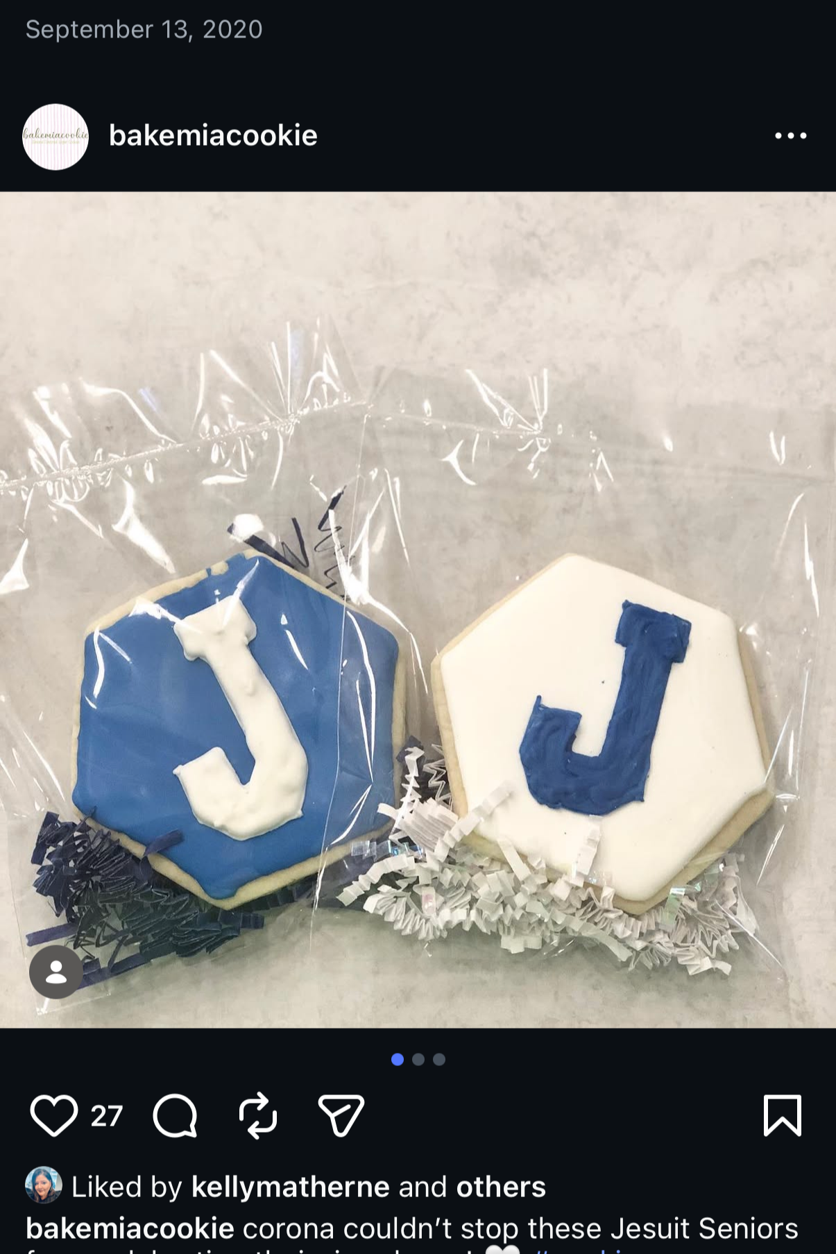Jesuit High School star-shaped cookies decorated with blue and white icing, each with a letter 'J' on top, wrapped in clear plastic with shredded paper.
