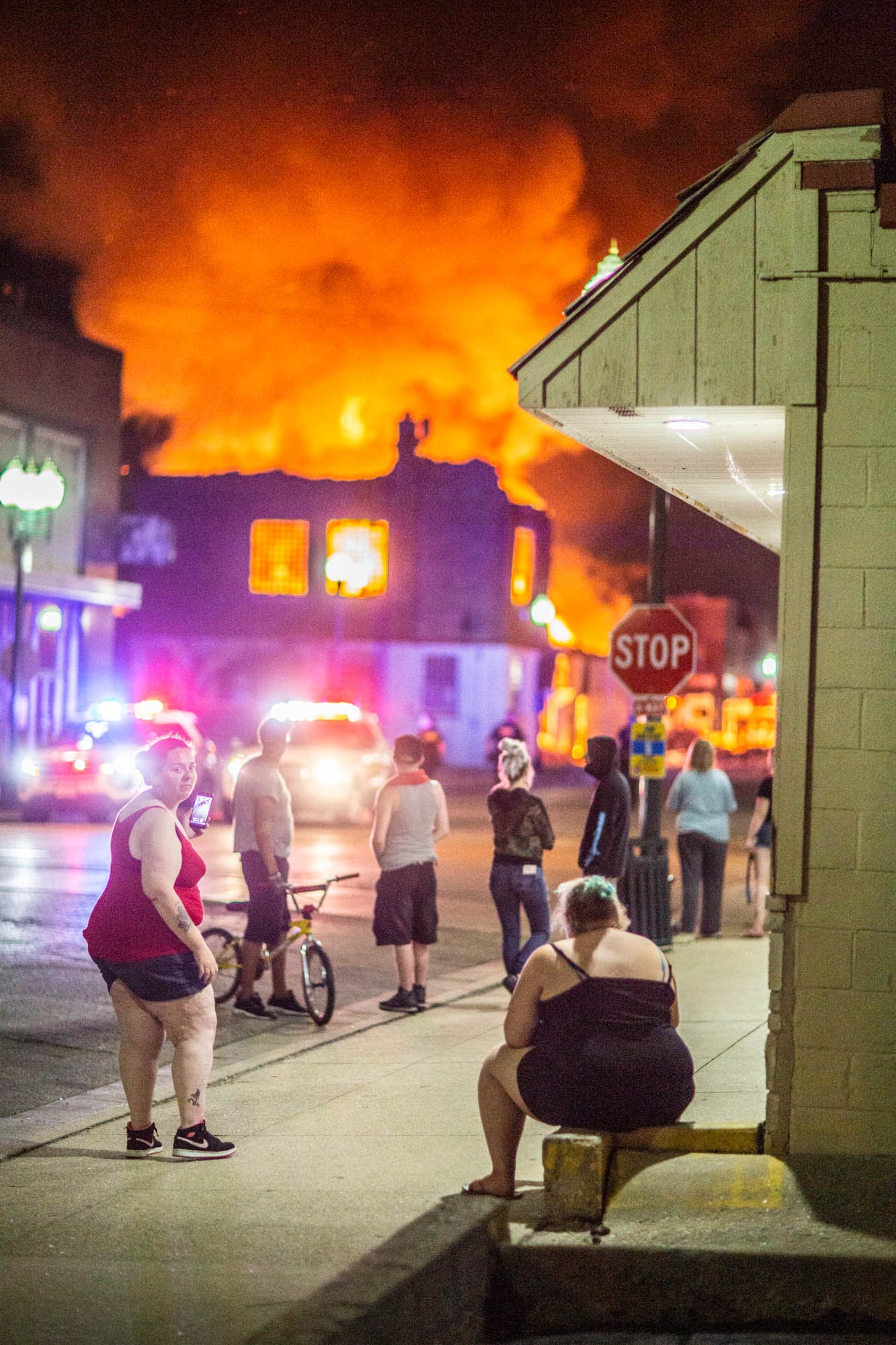 Another painting "Small town America catches fire." Reason: don't be a trigger happy cop."