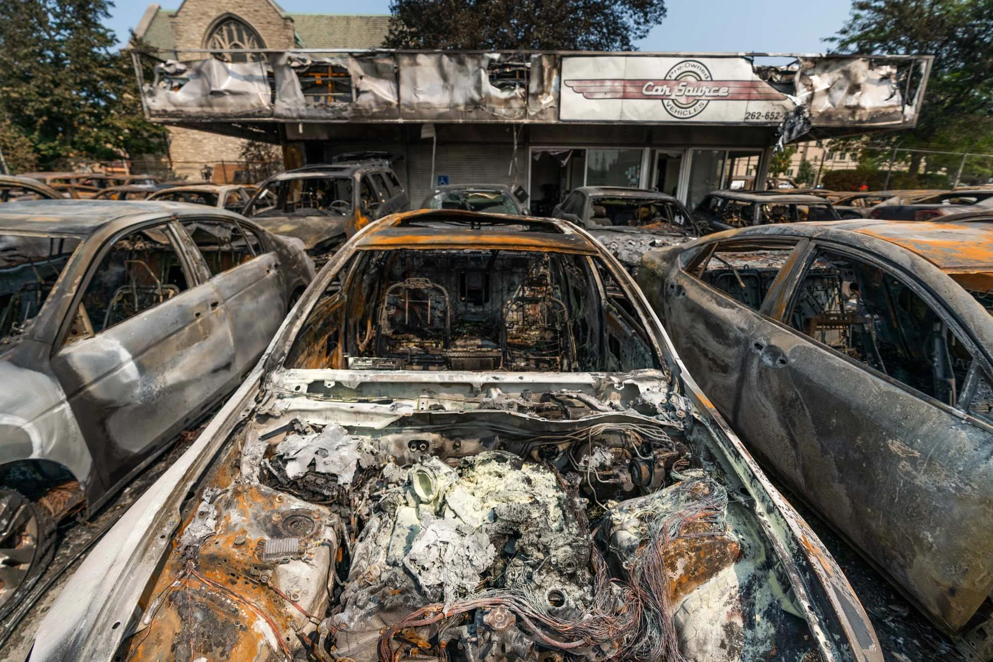 Like a painting in a dystopian America. Burnt from the inside. Note the church in the background.   