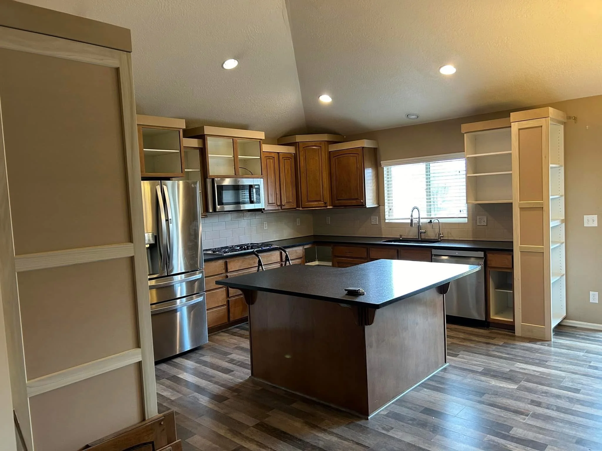Existing kitchen cabinets before custom door installation