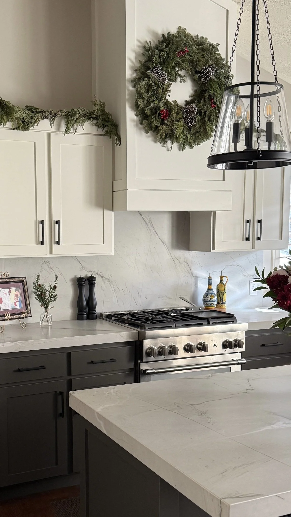 South Jordan Utah kitchen with new Shaker cabinet doors, custom Shaker vent hood, Mont Blanc quartzite countertops and full-height backsplash