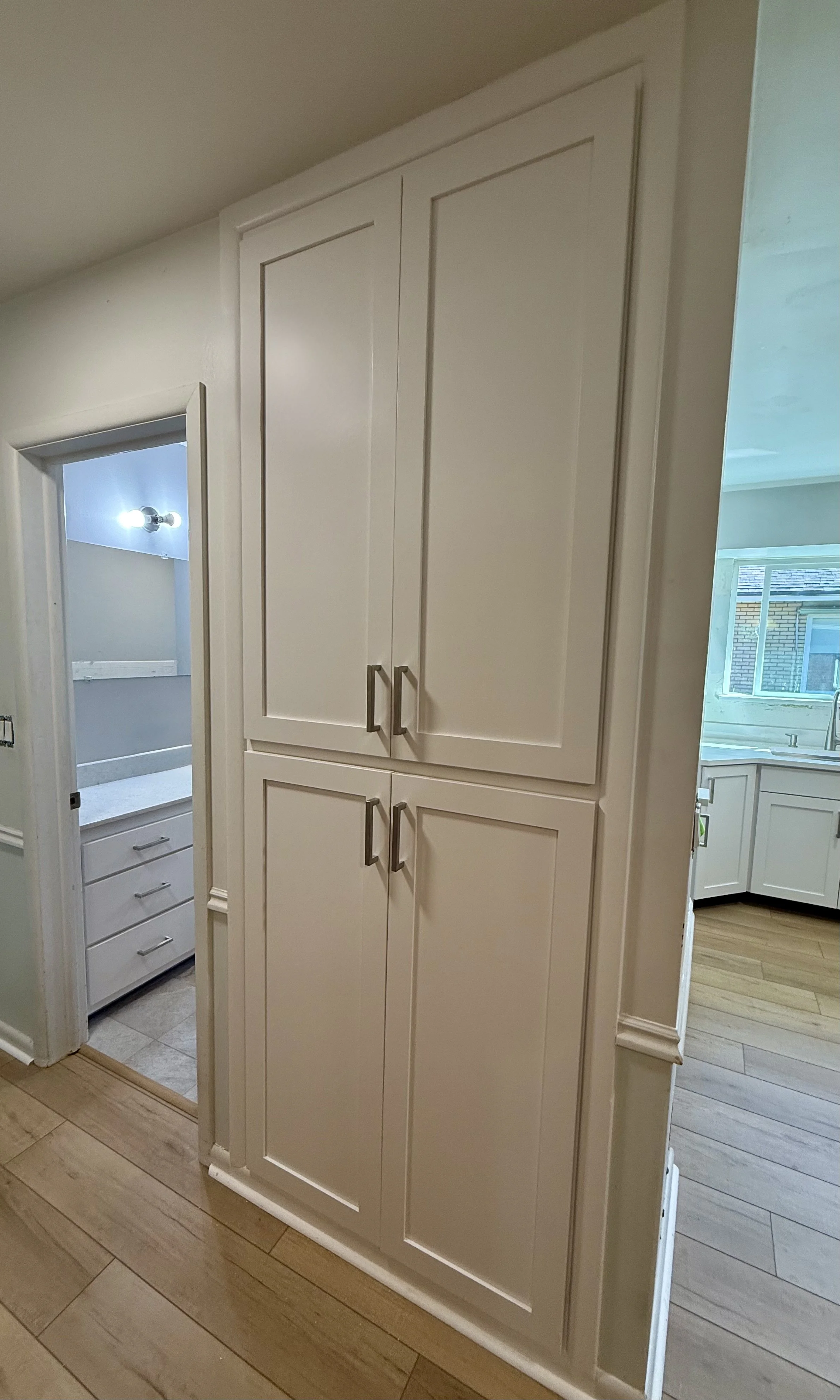 Built-in cabinetry in Murray, Utah after refinishing with new Shaker doors and updated hardware