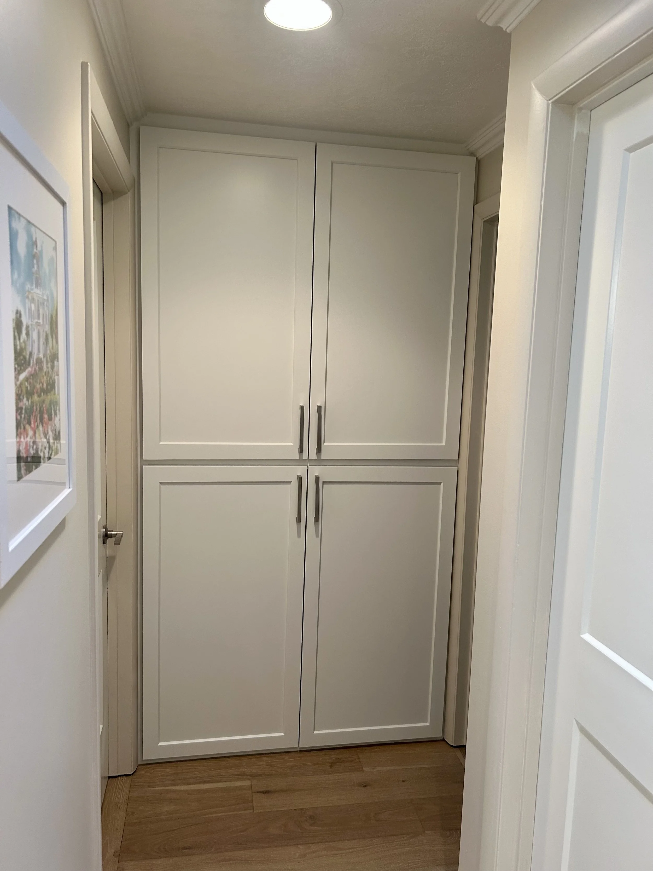 Hallway cabinetry with new Shaker cabinet doors after door replacement in Cottonwood Heights, Utah