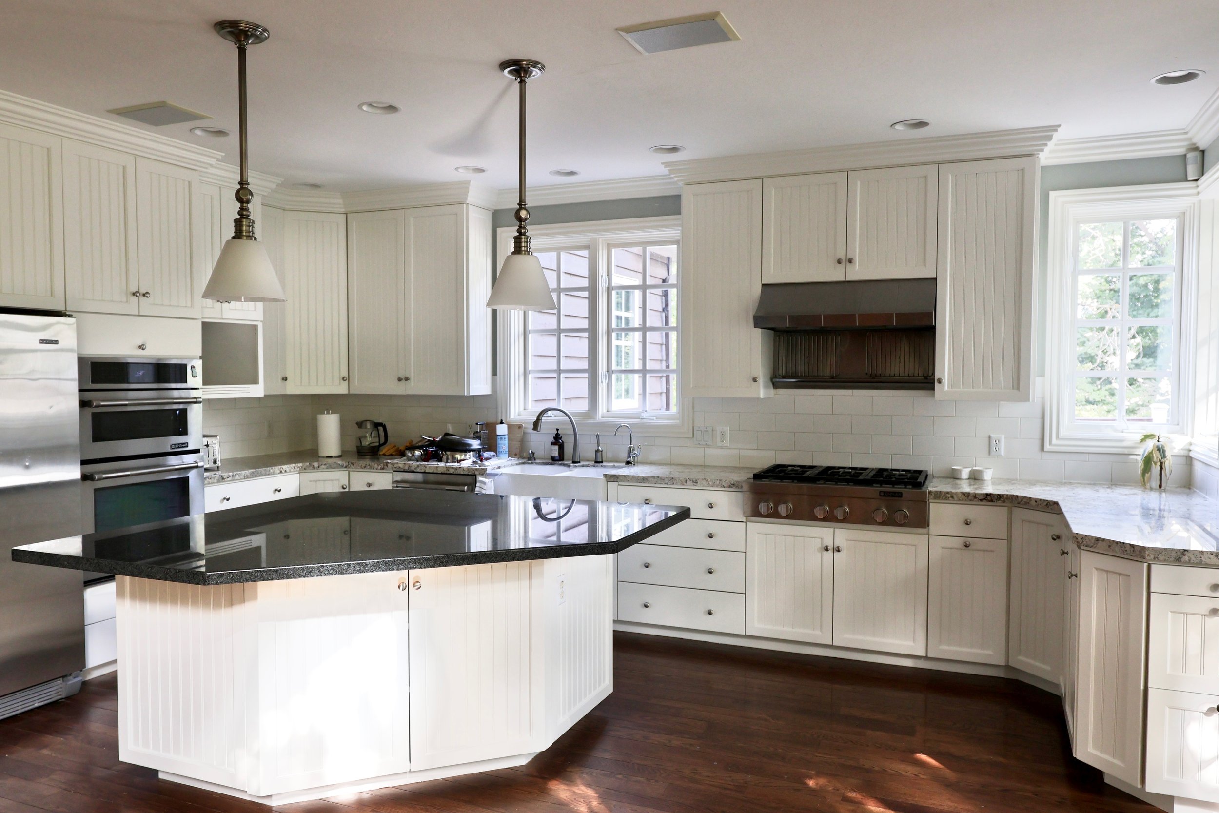 Holladay, Utah kitchen after professional cabinet refinishing with restored white cabinetry