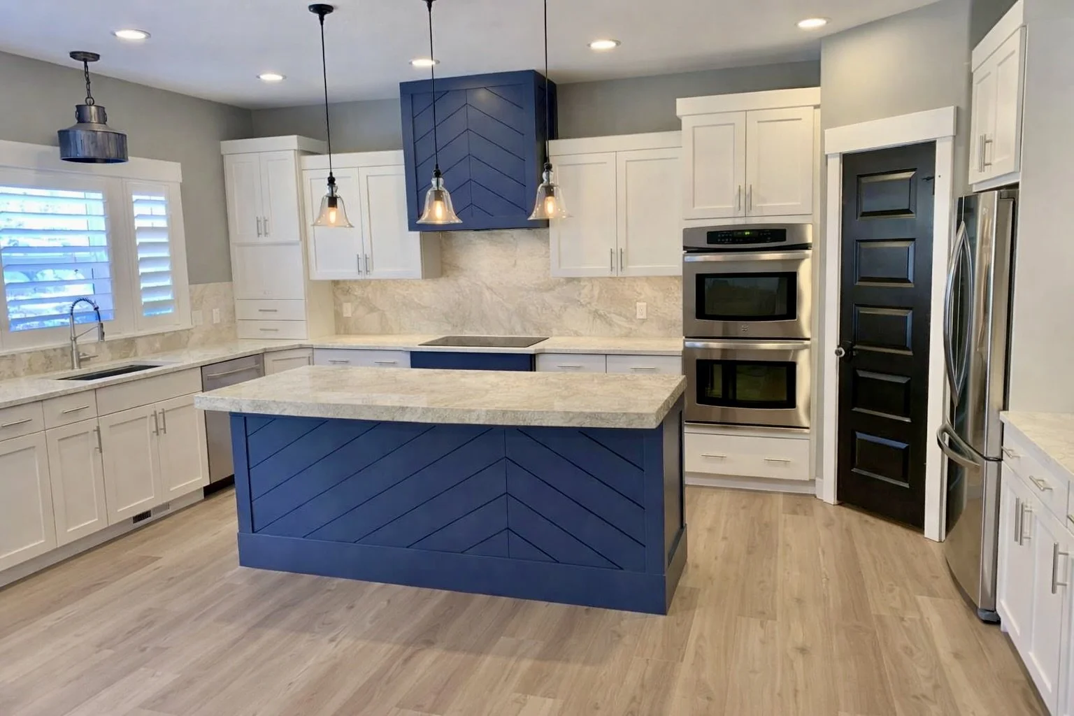 Refinished cabinetry with coordinated stone countertop and backsplash installation