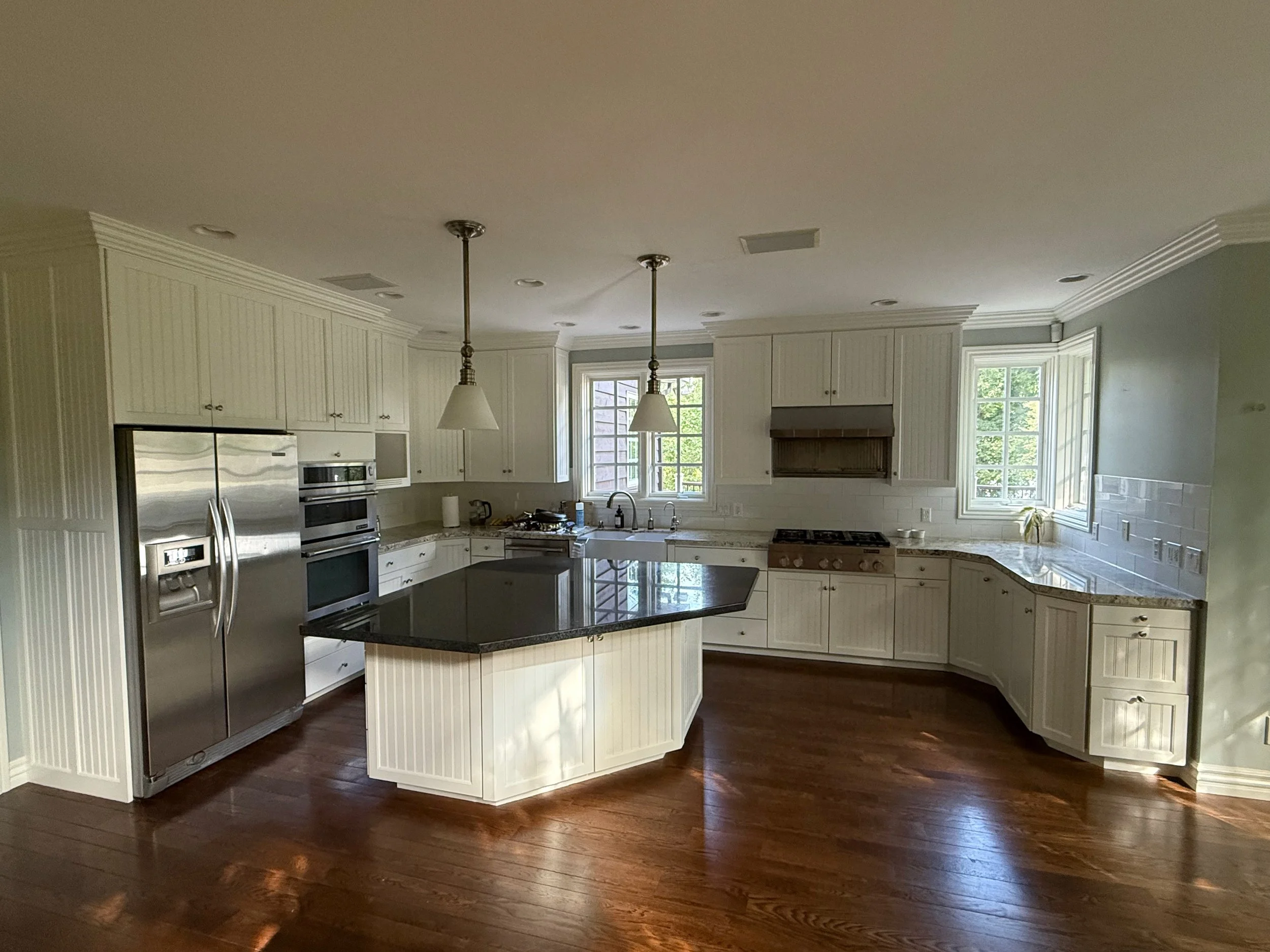 Restored Holladay, Utah kitchen cabinets after refinishing, door and drawer repairs and soft-close hinge upgrades