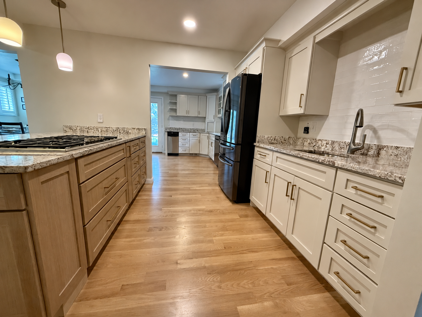 AFTER | Bountiful, Utah Kitchen Cabinet Refinishing & Refacing: CAZI Refined Finishes transformed the dark cherry cabinetry with Sherwin-Williams SW 9530 Taupe of the Morning, while completely refacing the island with Rift White Oak, including new Sh