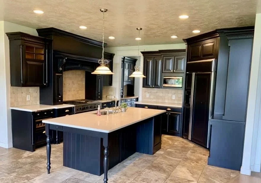 Kitchen cabinet refinishing transformation with dark painted finish 