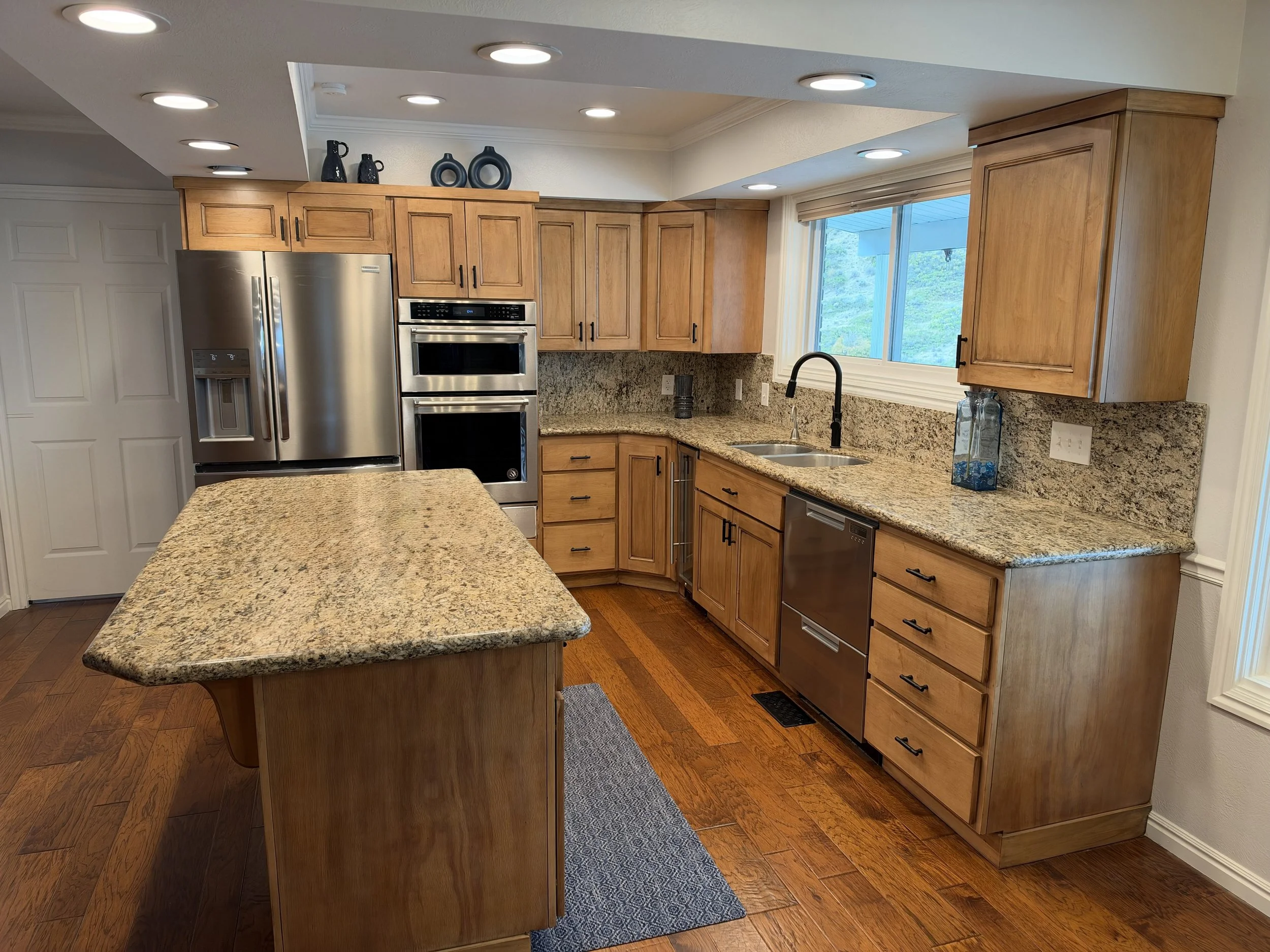 AFTER |  Spanish Fork Kitchen After Refinishing with New Shaker Doors: 

This Spanish Fork, Utah kitchen was transformed with new Shaker cabinet doors and drawer fronts, professionally stained to create a warmer, updated finish. CAZI replaced the exi