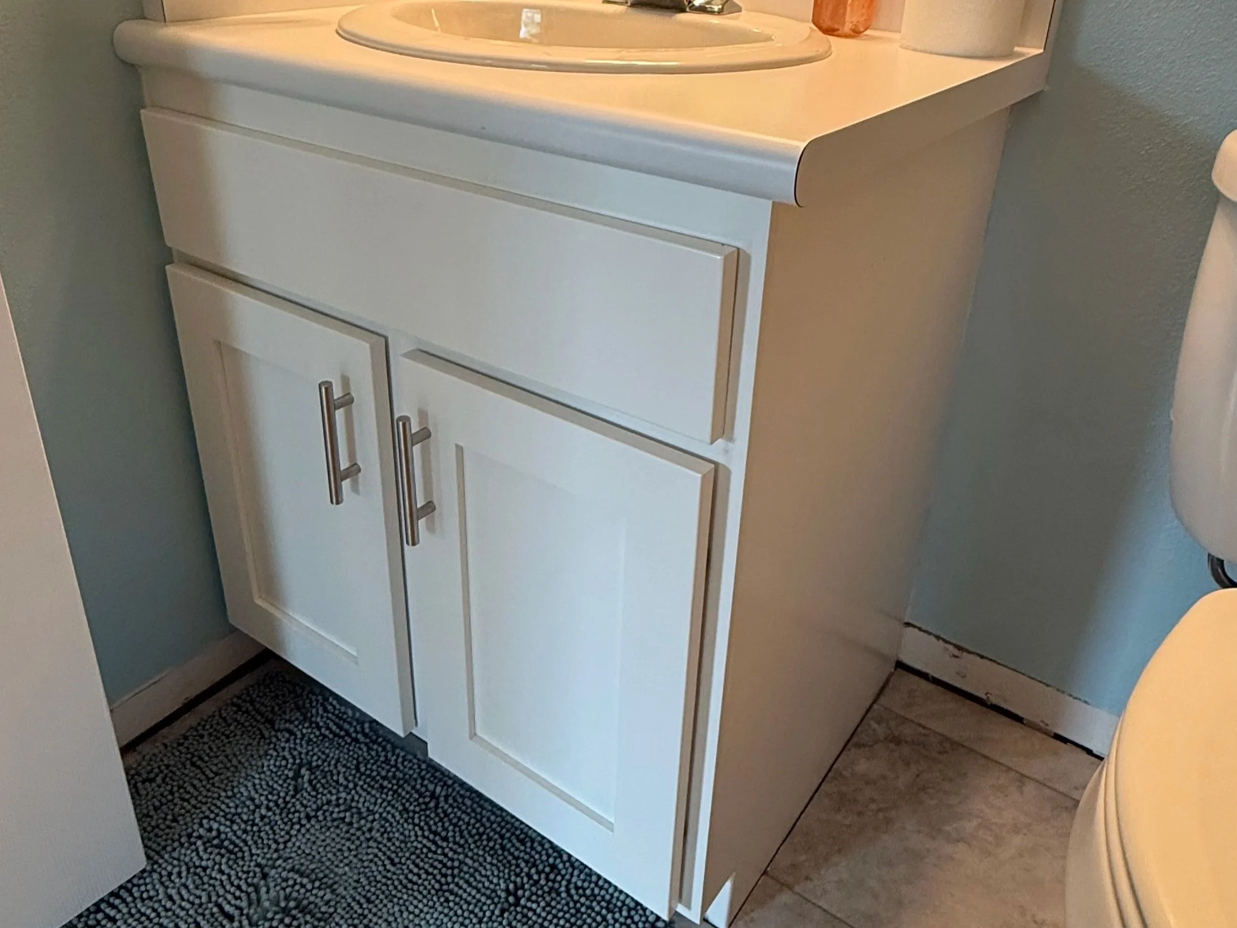 Provo Utah bathroom vanity after cabinet refinishing with new Shaker doors, soft close hinges and updated hardware.