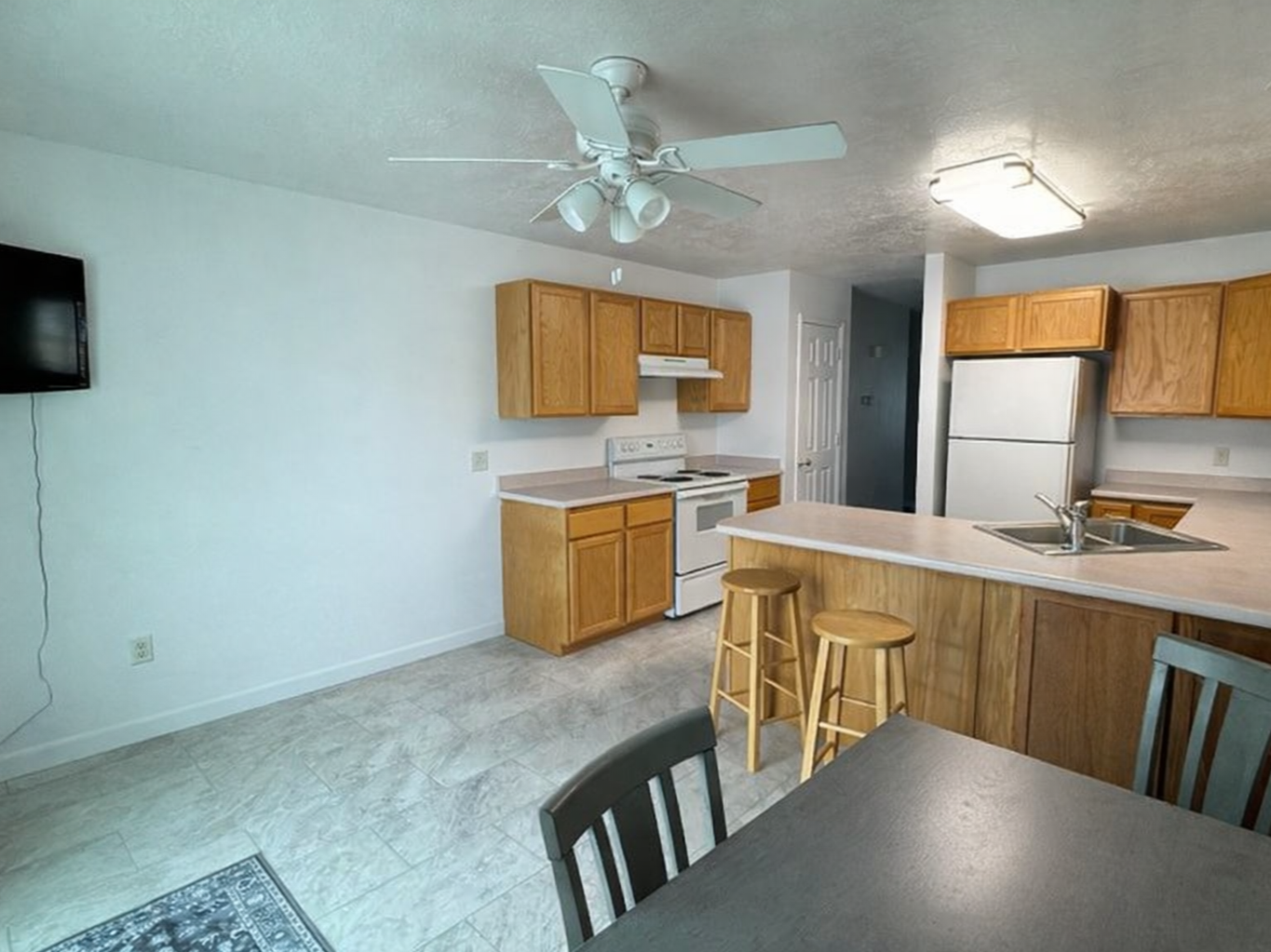 Provo Utah kitchen before cabinet refinishing with original oak cabinets and laminate countertops