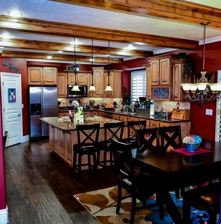 Kitchen with original stained wood cabinets prior to refinishing