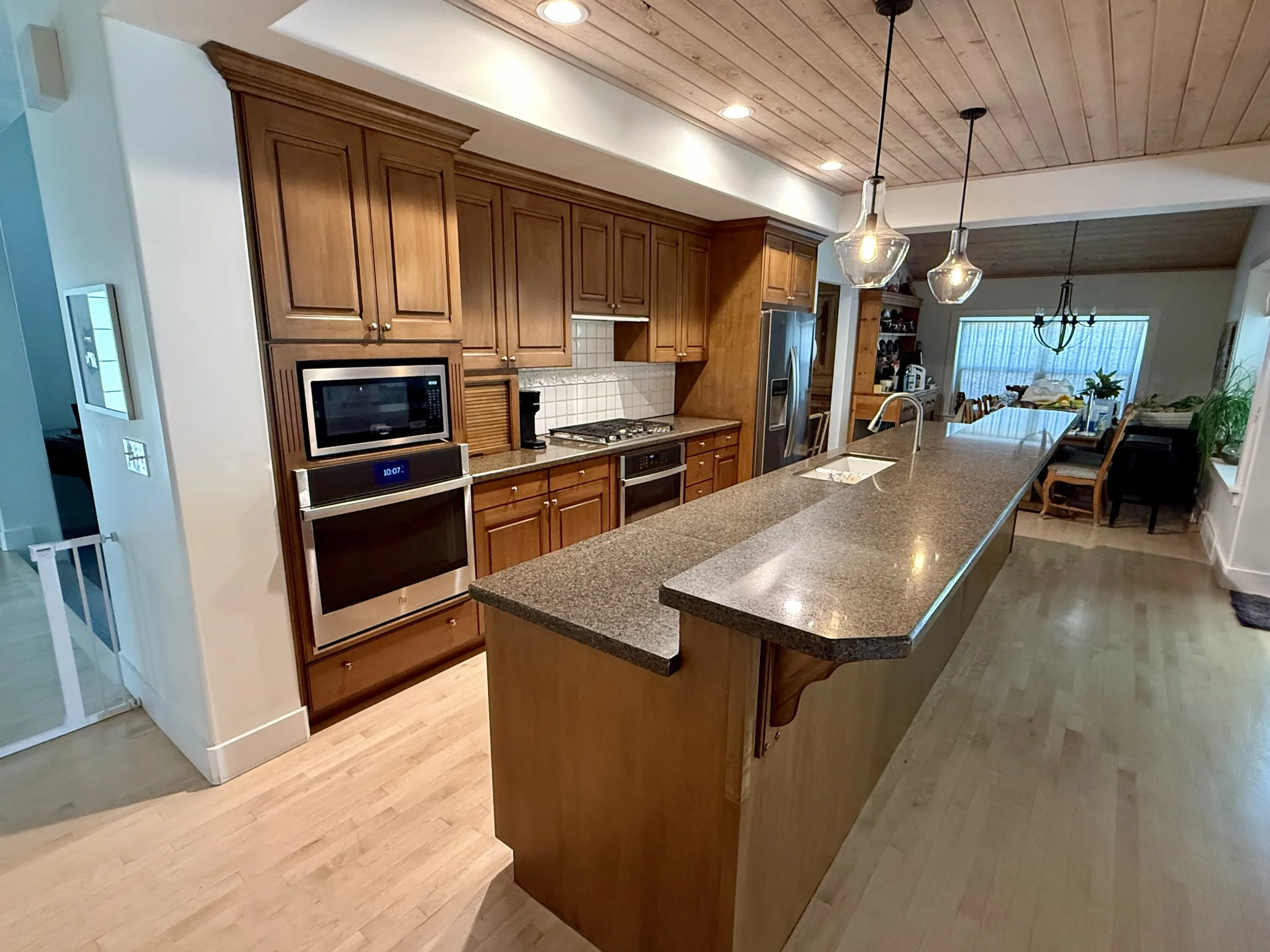 Kitchen before cabinet refinishing in Cottonwood Heights, Utah