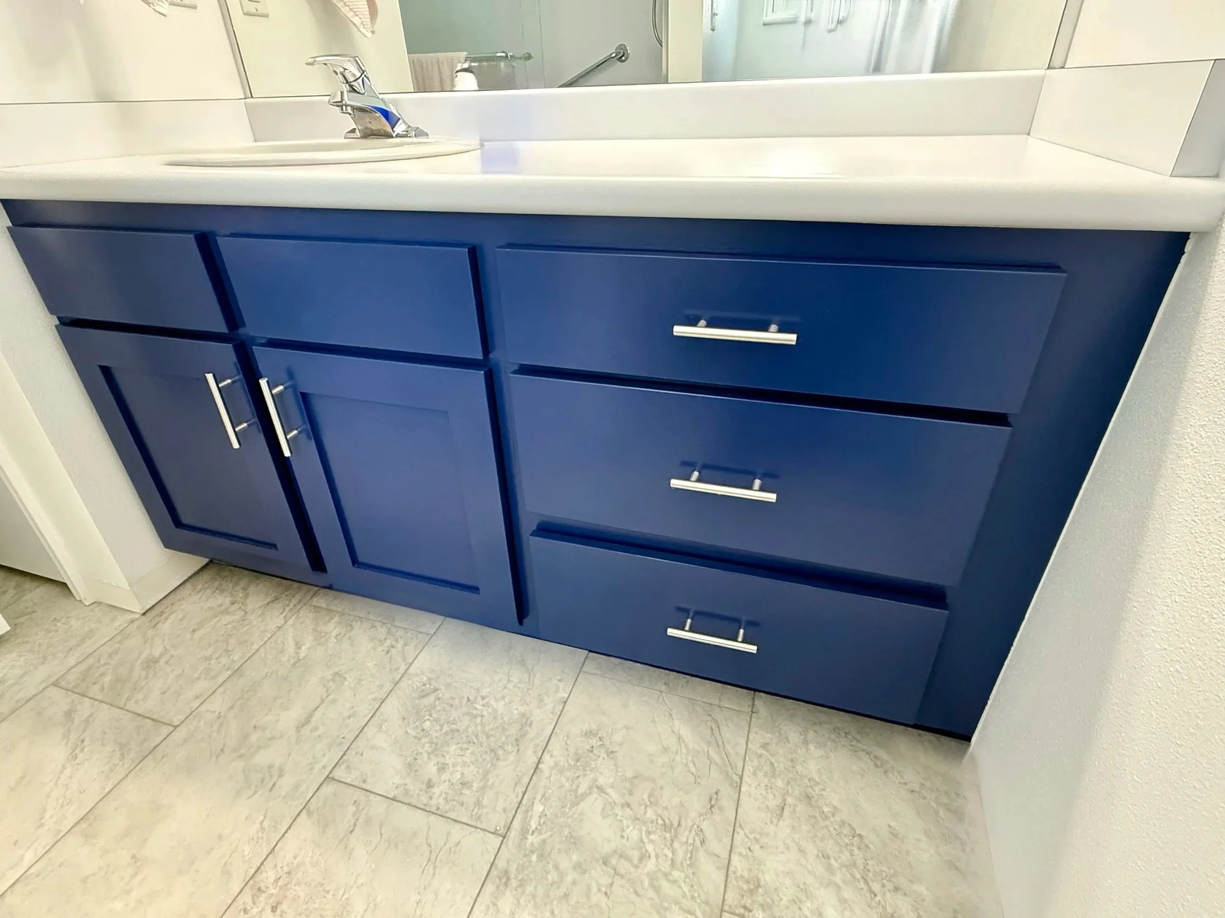 Wide Provo Utah bathroom vanity after cabinet refinishing with new Shaker doors, soft close hinges and updated hardware.
