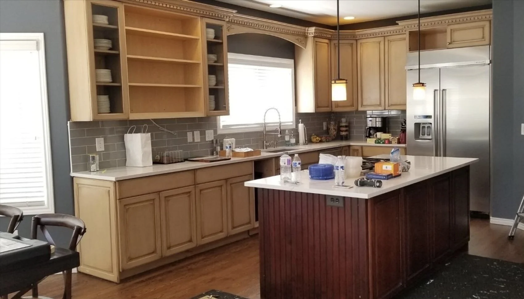 Dated kitchen cabinetry before hardware and finish updates