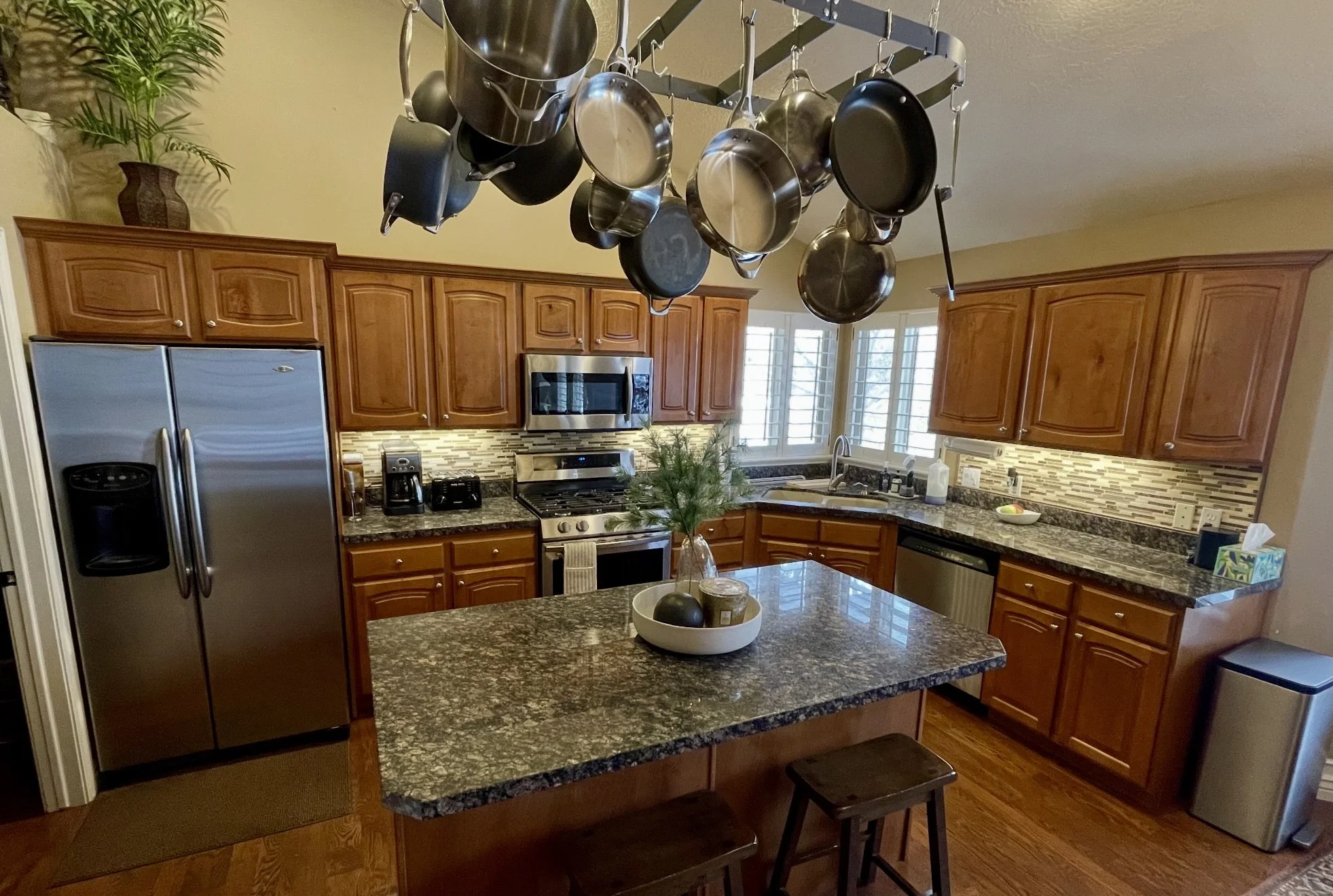 South Jordan, Utah kitchen before cabinet refinishing with orange toned wood cabinets