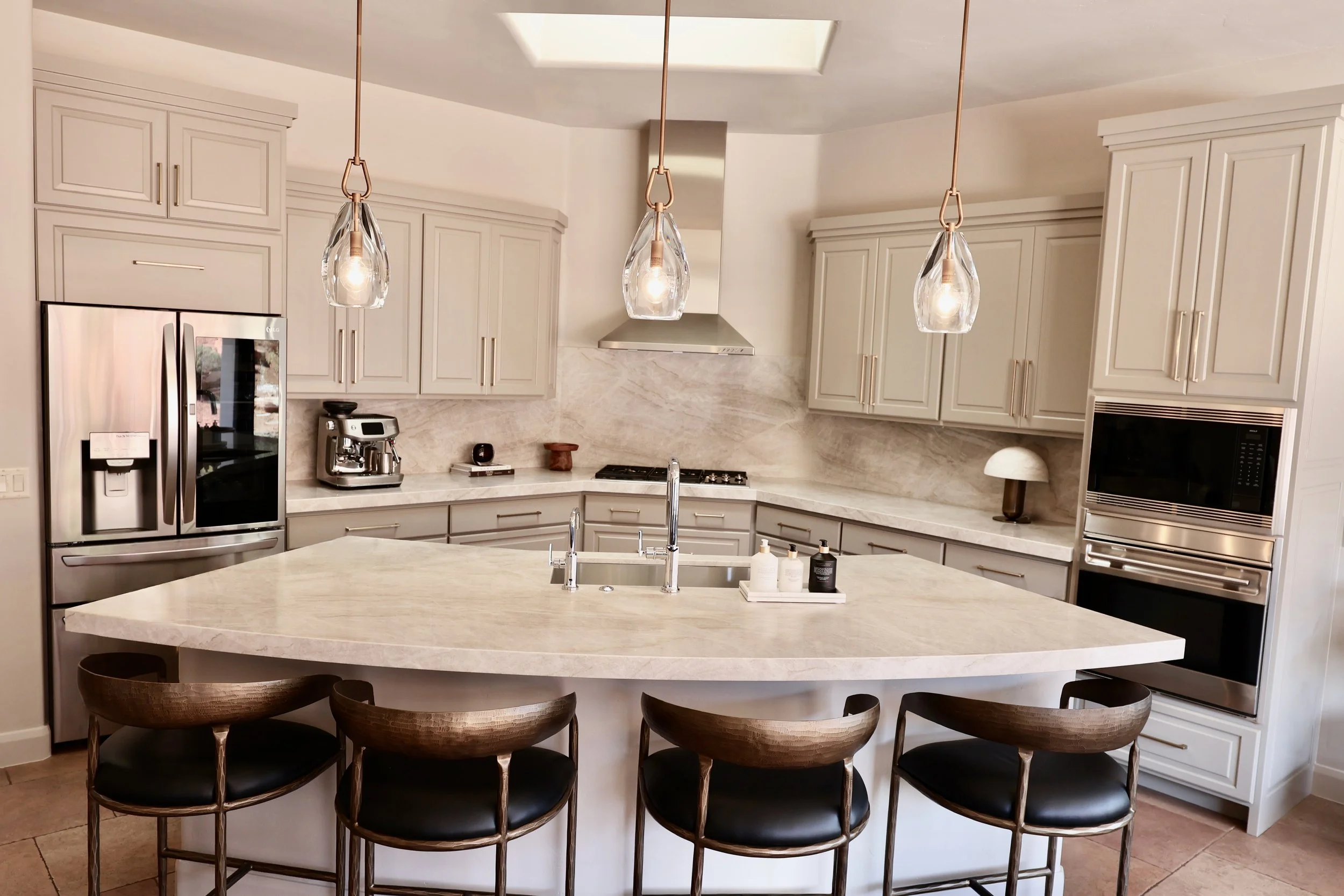 St. George Utah kitchen after cabinet refinishing with painted cabinets, Taj Mahal quartzite countertops and full-height backsplash