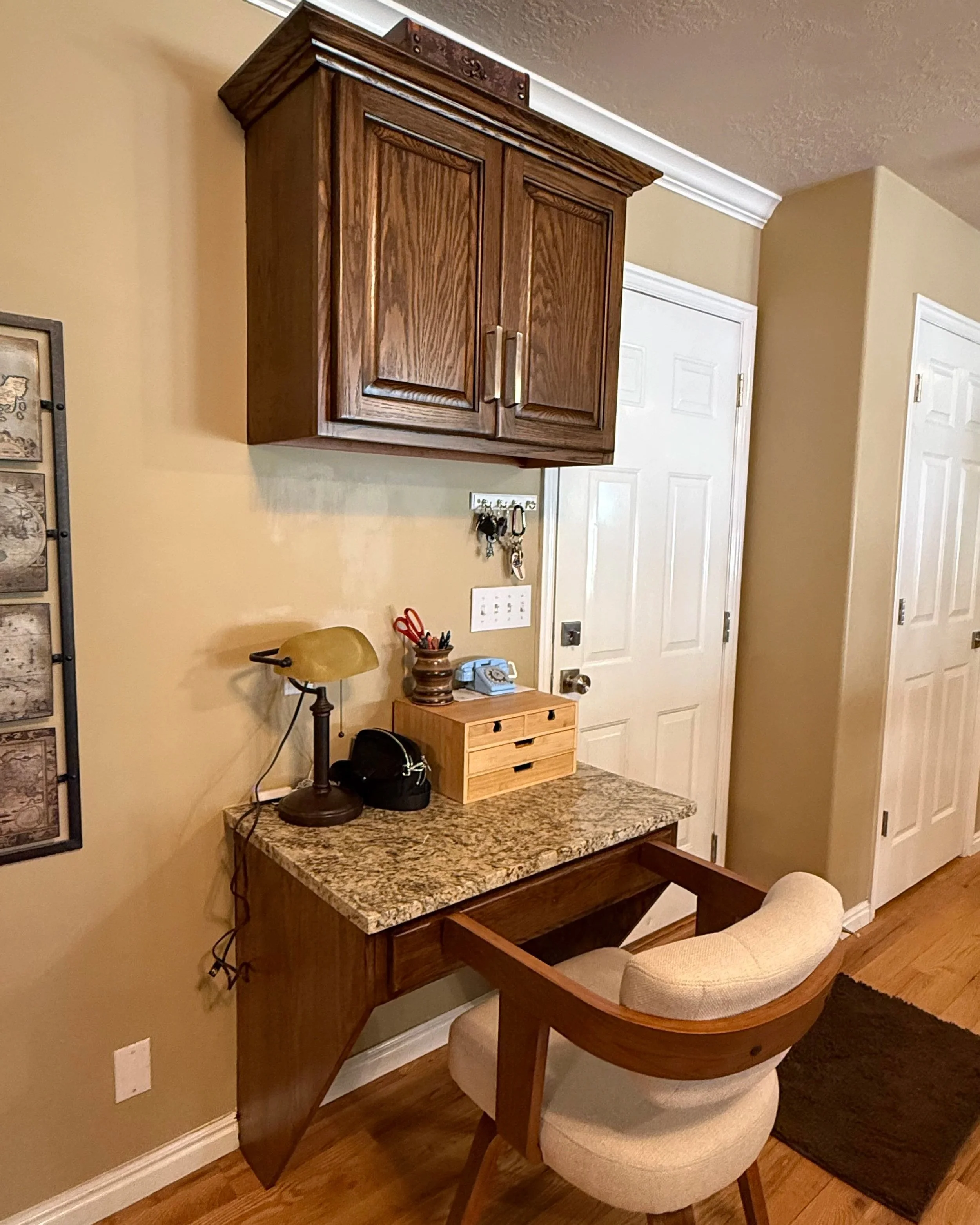 North Salt Lake built-in desk cabinetry professionally refinished in a richer wood tone with new granite countertop