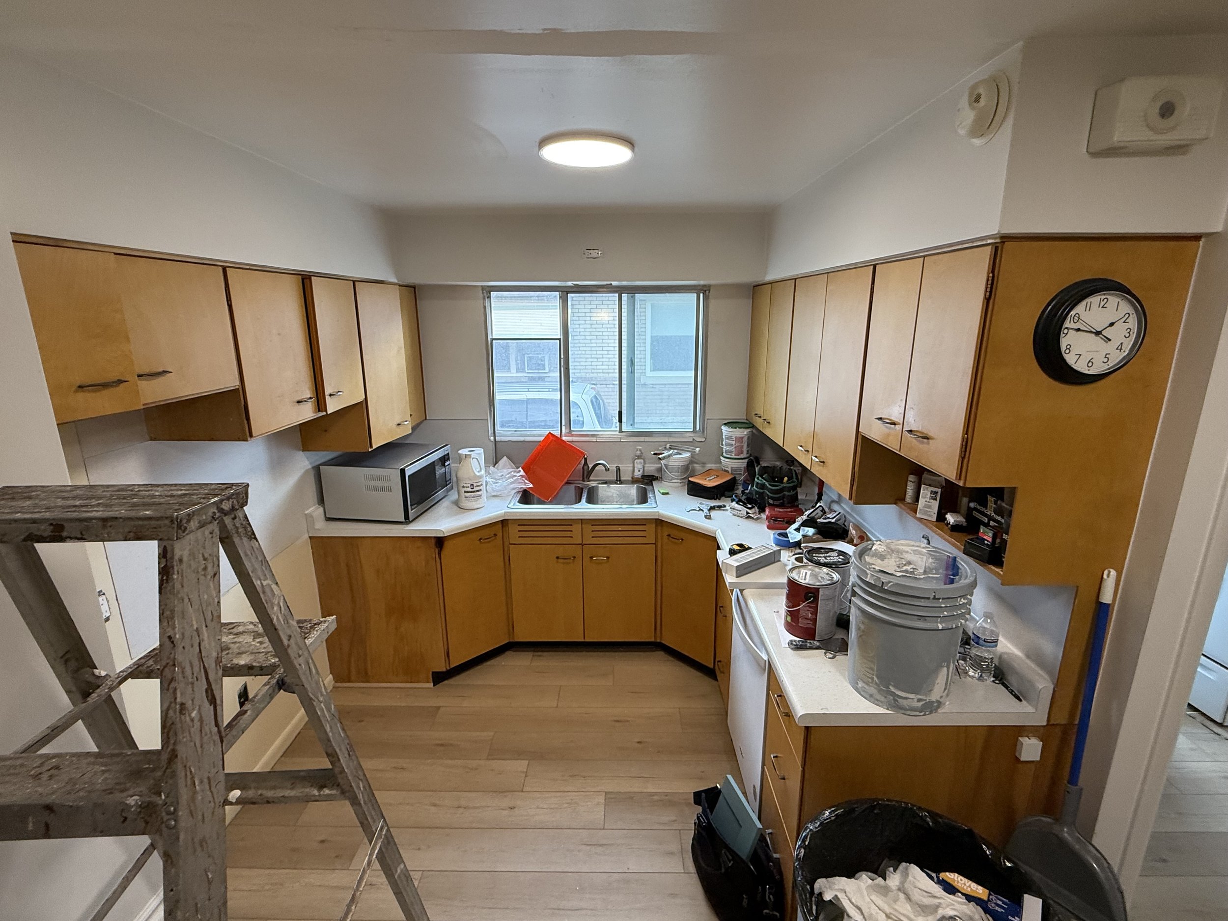 BEFORE | Murray, Utah — Before Cabinet Refinishing: 

This Murray kitchen had 70-year-old cabinetry with solid cabinet boxes, but the dated doors, drawer fronts, and hardware were ready for a fresh, updated look.