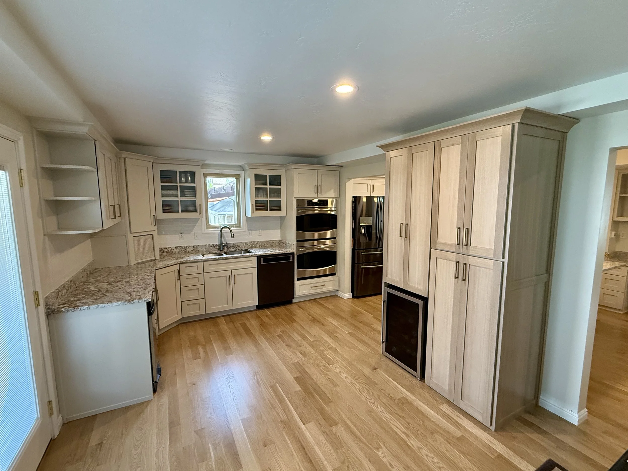 Bountiful, Utah kitchen after cabinet refinishing with warm taupe and light white oak cabinetry