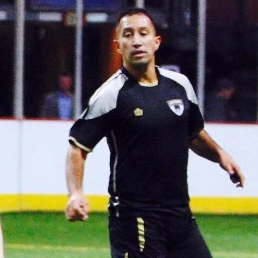 Man in black and white sports uniform on the field