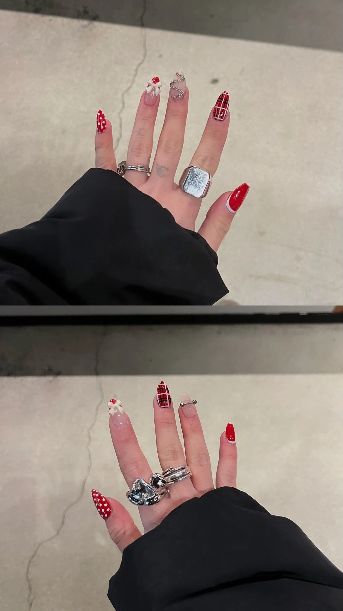 Close-up of a person's hand with red and polka dot Christmas-themed nail polish and jewelry, with the background showing a concrete floor.