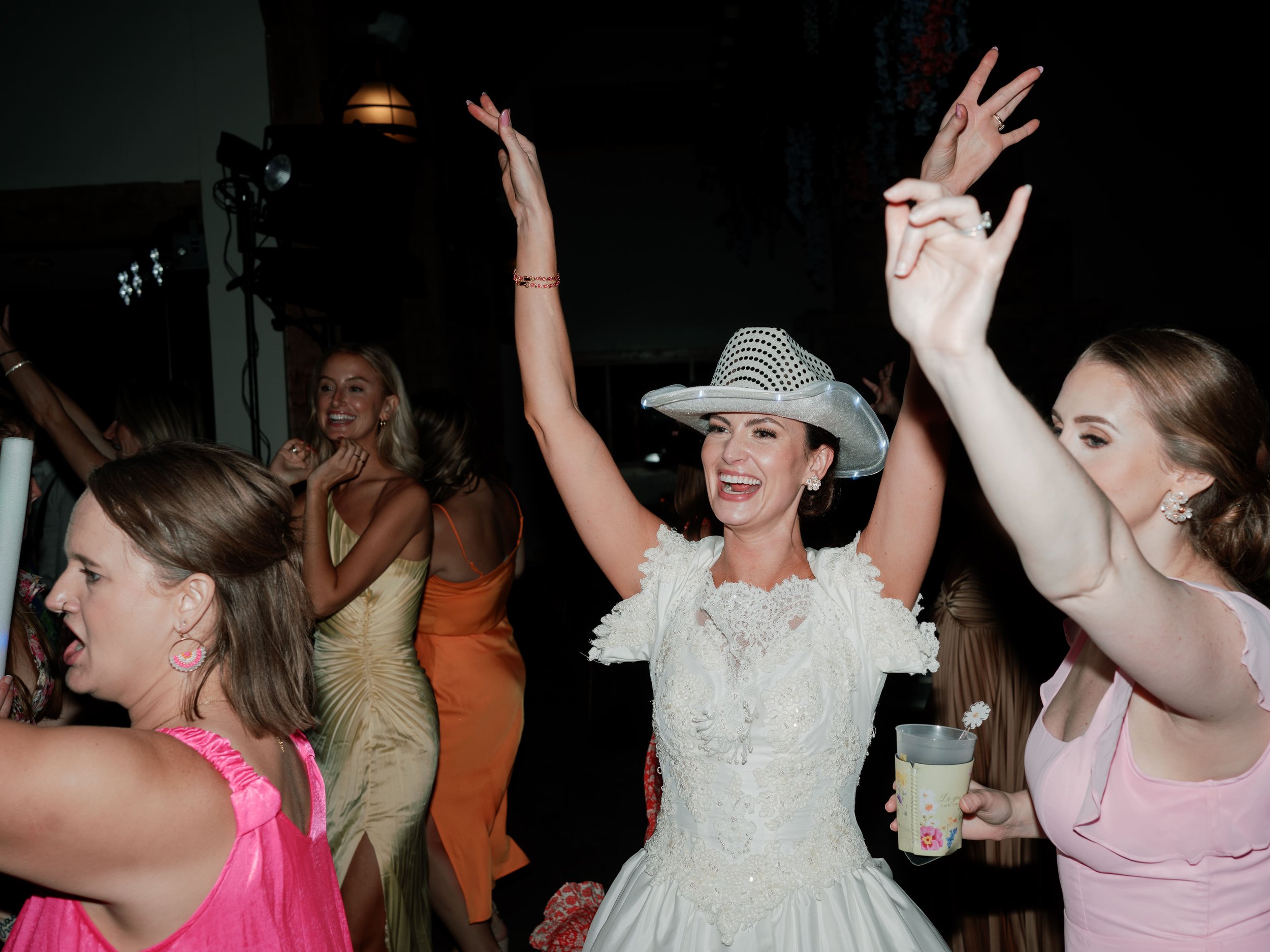 Laurie’s customers, Evan and Kade, running down a mountain after getting married. 