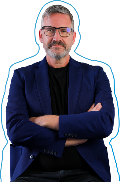 A middle-aged man with gray hair, beard, and glasses, wearing a navy blazer and black shirt, standing with arms crossed against a plain background.