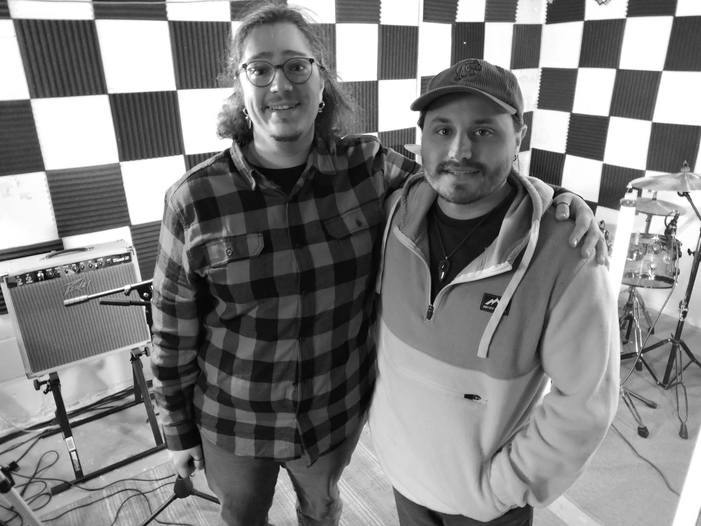Kasim and James standing in front of the studio space
