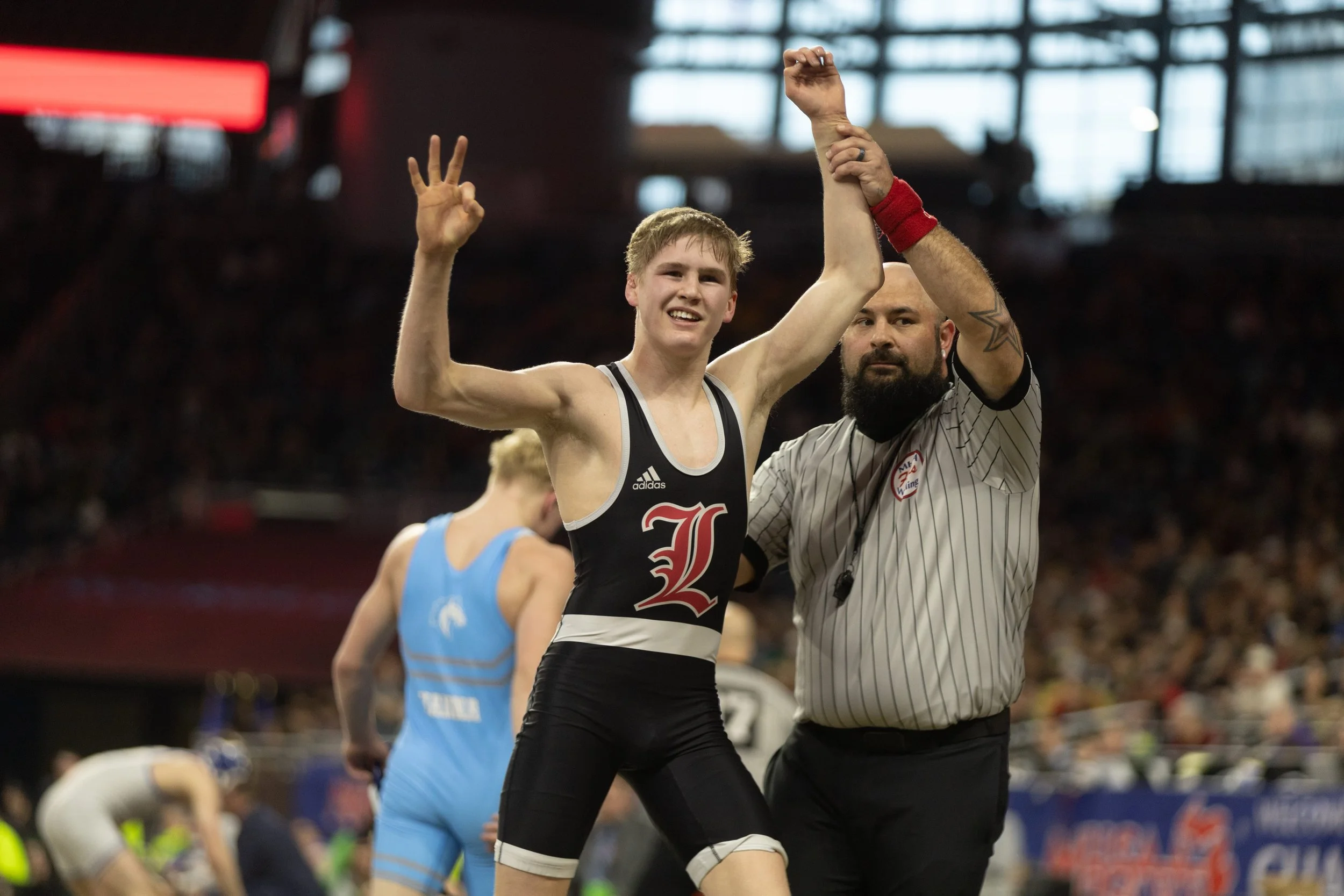 The Photos - Nine Lowell Wrestlers Earn Top-4 Honors