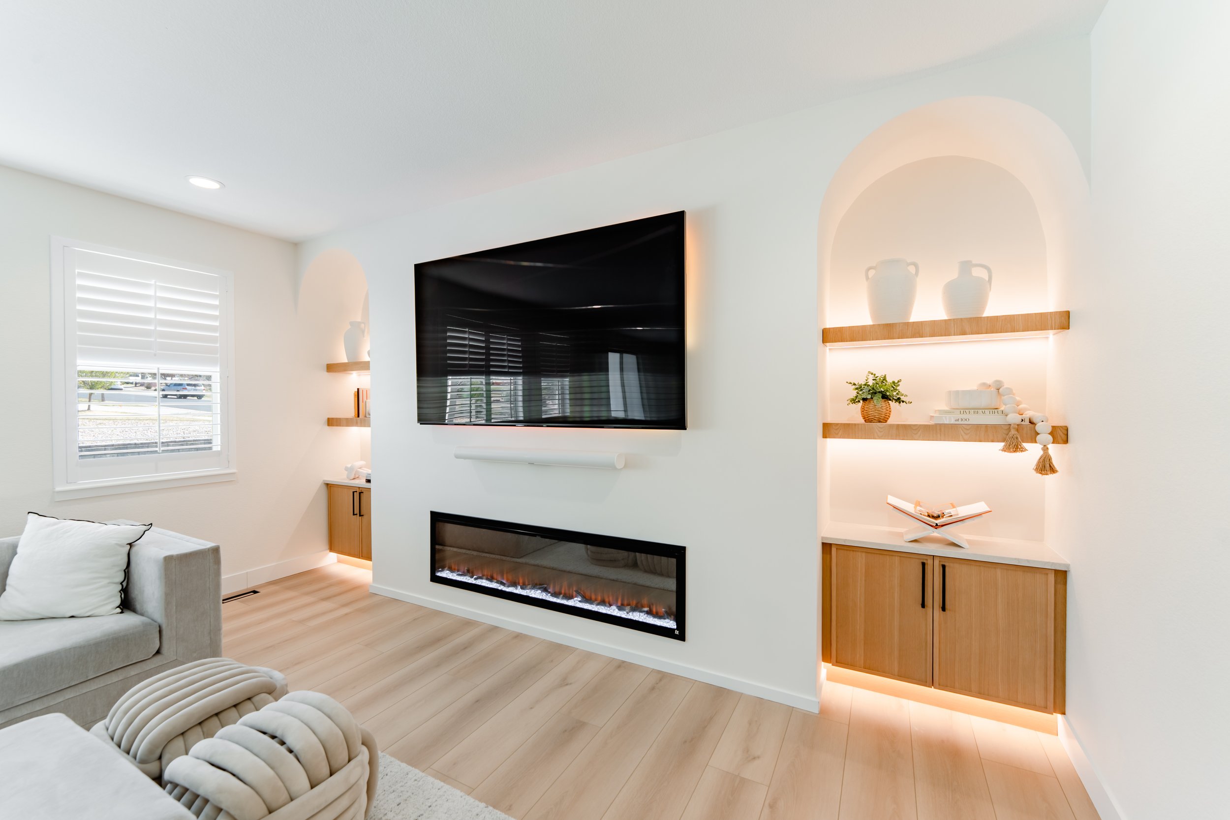 Entertainment wall, custom cabinets and countertop with arches & ambient lighting