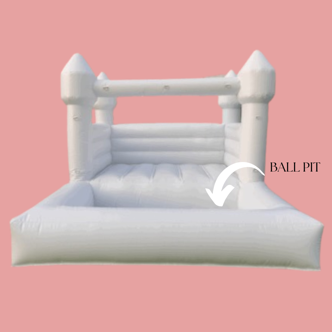 Inflatable white bounce house with a ball pit area, set against a pink background.