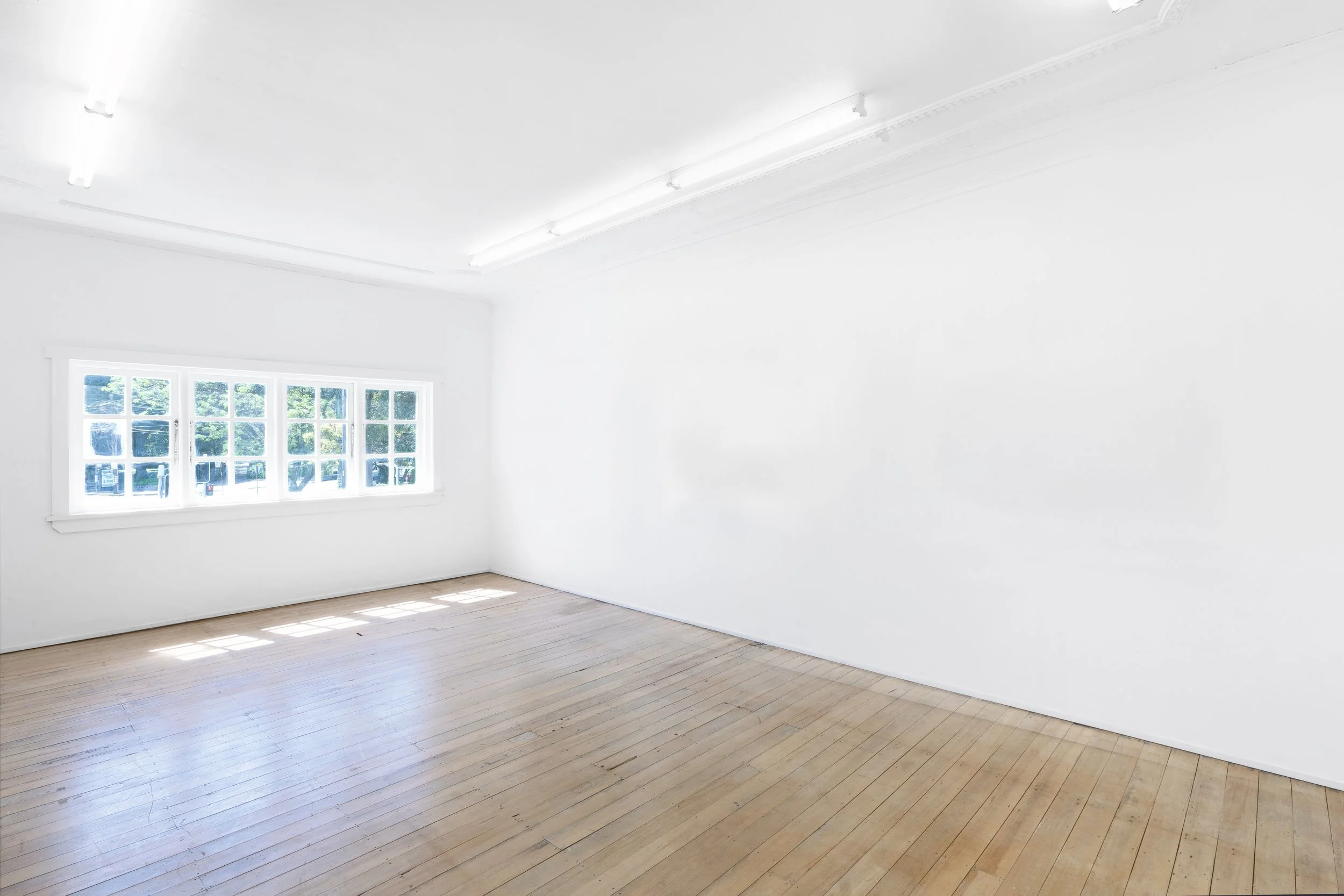 Photo of sunlit gallery space available for exhibitions