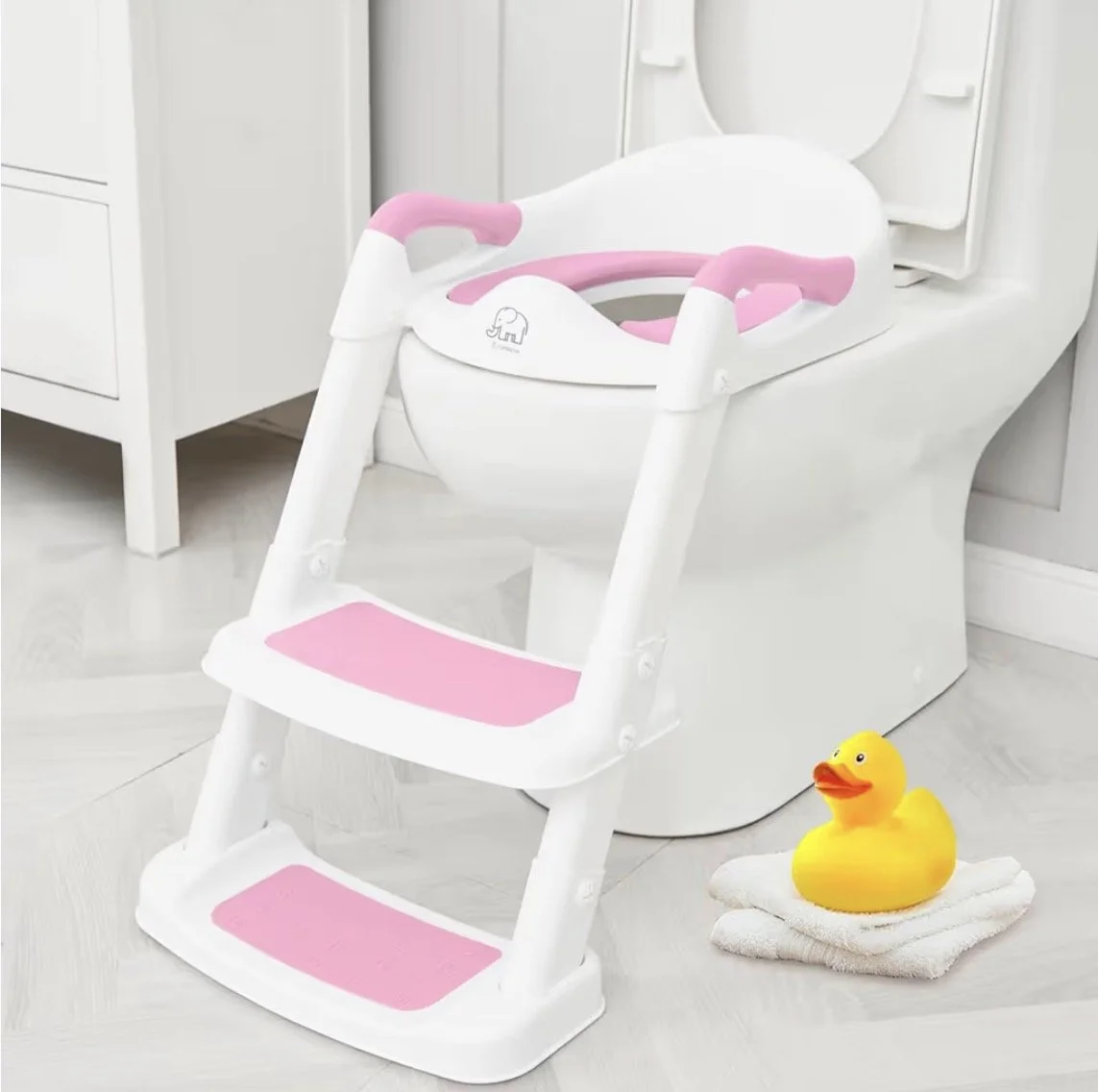 Adjustable toddler potty training seat with ladder, non-slip steps, splash guard, and handles for safe and easy toilet training on standard toilets.